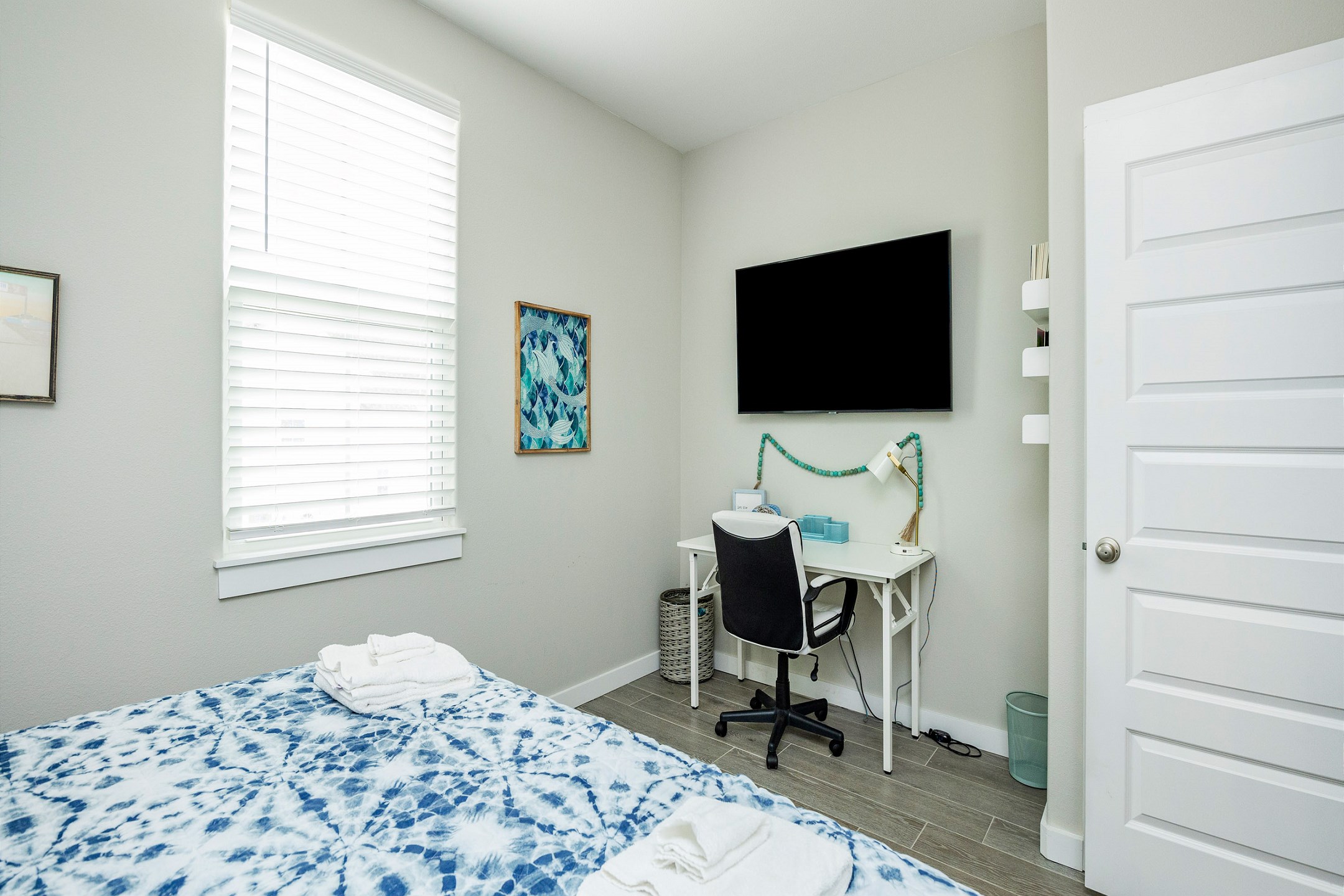 Inviting second floor guest bedroom with a king size bed