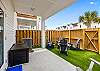 Private patio with turf and plenty of seating for entertaining