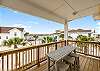 Upstairs back patio with bar seating and water views