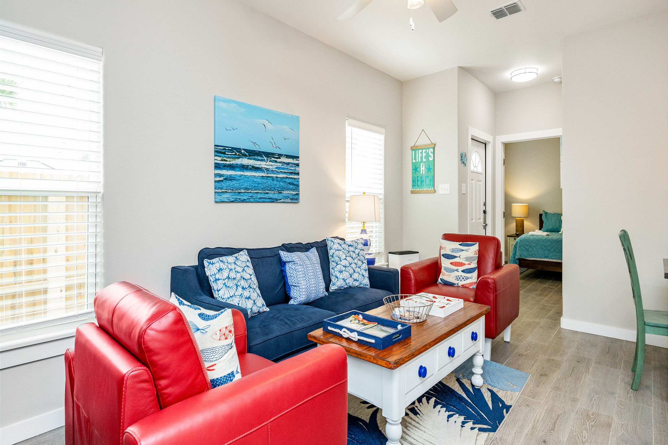 Kick back and relax in this spacious, sunlit living area with a comfy sofa and two inviting chairs. Light, bright, and airy—it''s the perfect spot to unwind after a day of adventure.