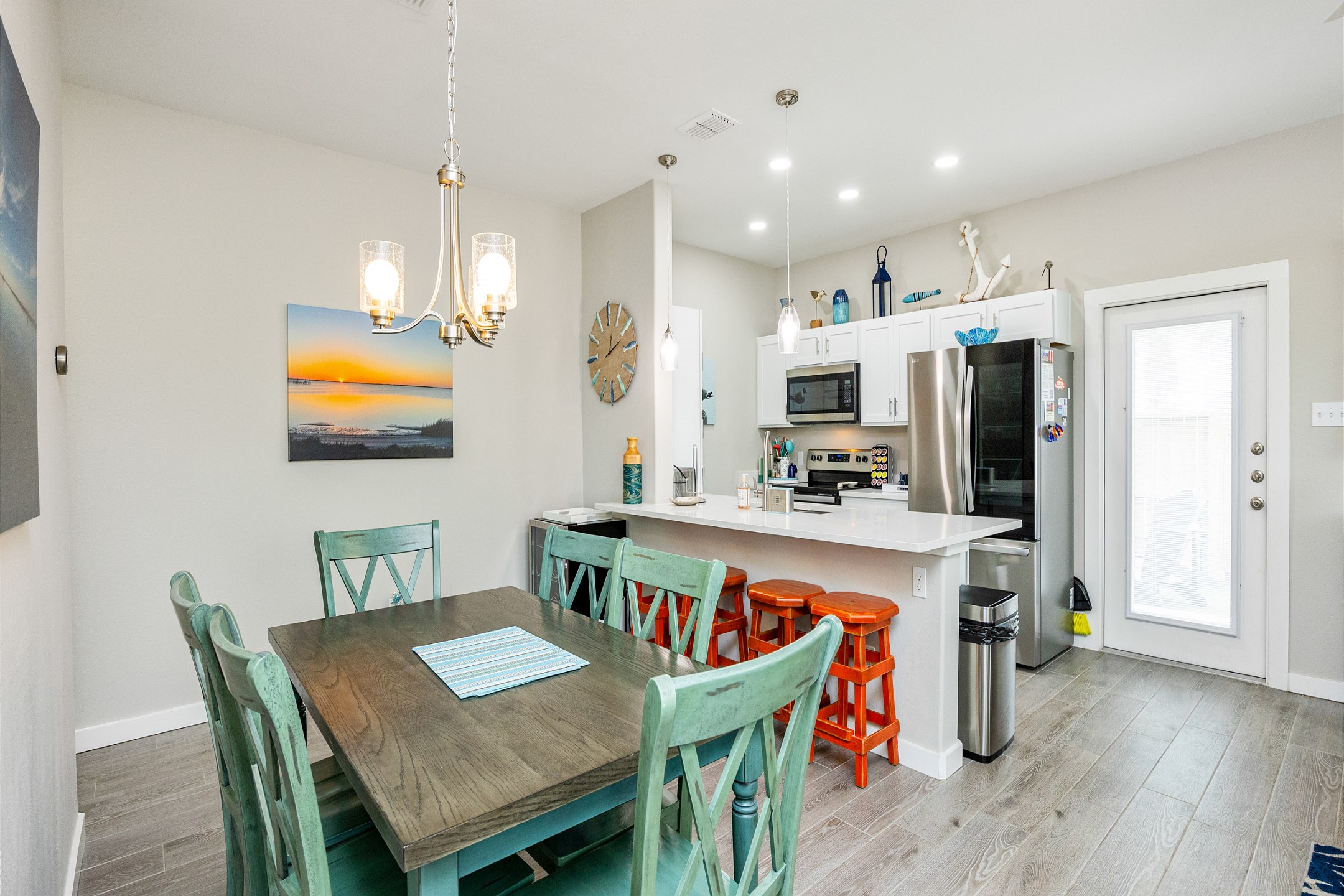 The dining area with seating for six is perfect for family meals, and there''s extra space at the breakfast bar for casual bites or morning coffee, all within a laid-back, vacation vibe.