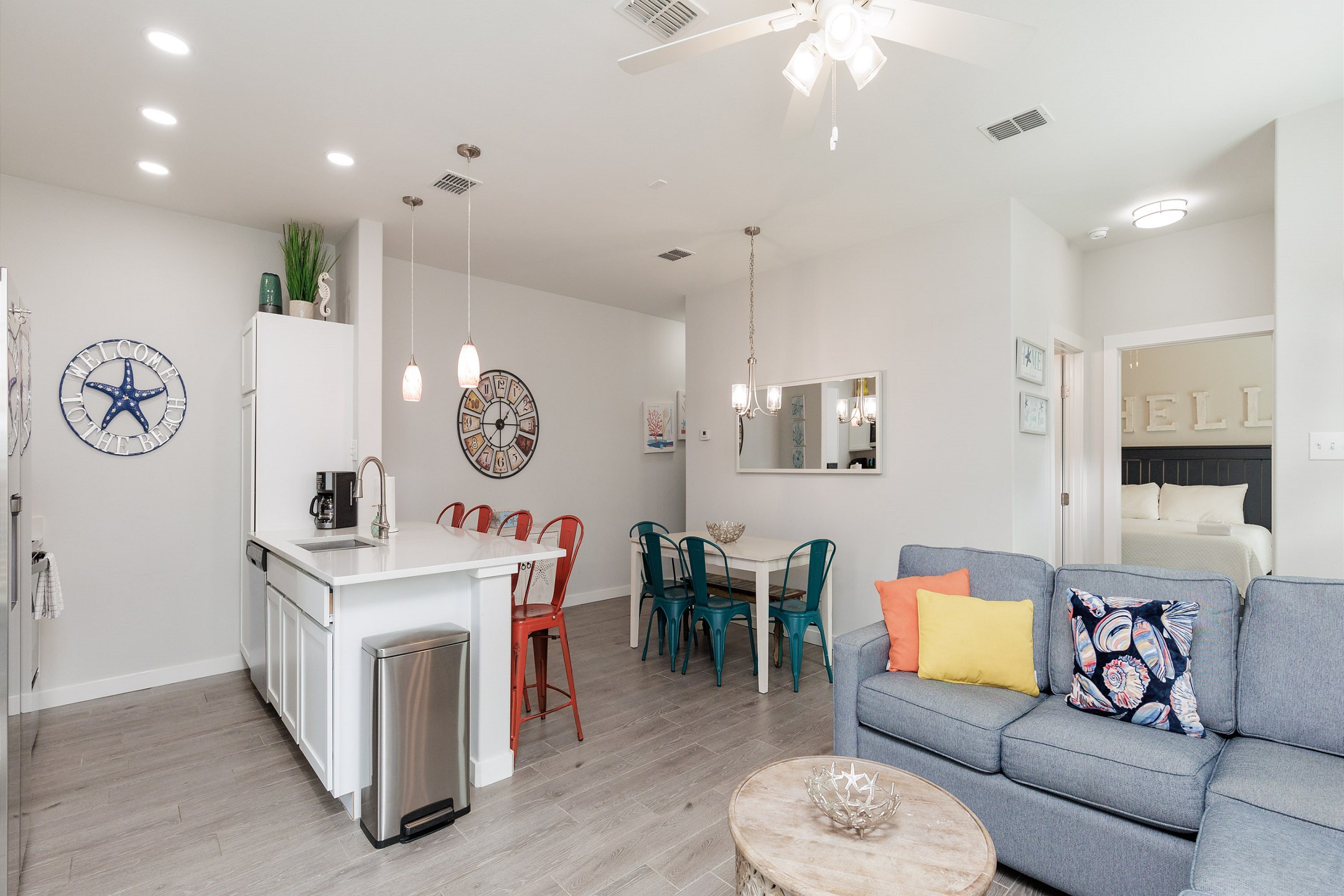 Spacious living with plenty of comfortable chairs and bright lighting to entertain with guests