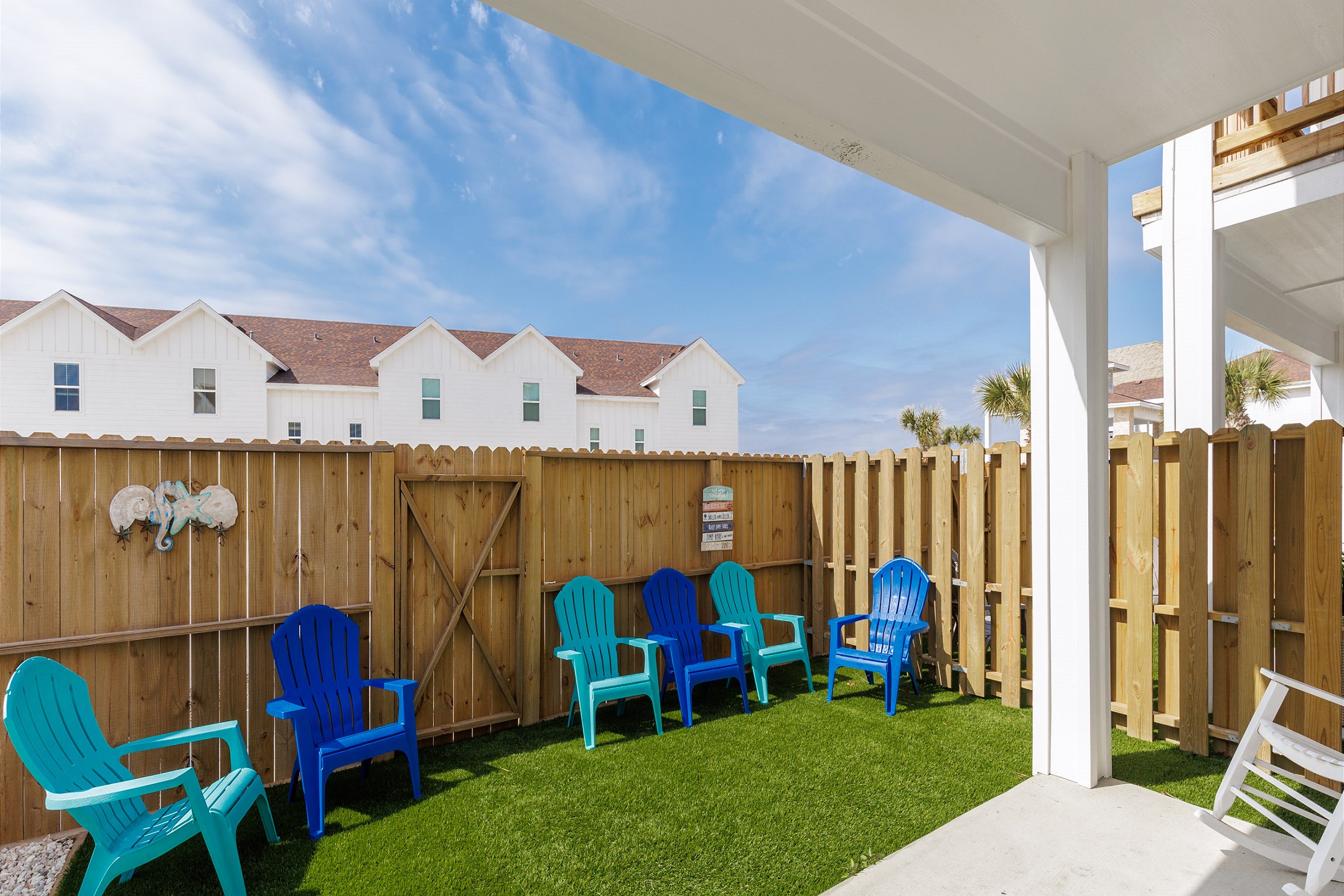 Private, fenced in patio with chairs and turf to enjoy the Texas breeze
