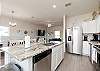 Fully stocked kitchen with stainless steel appliances 