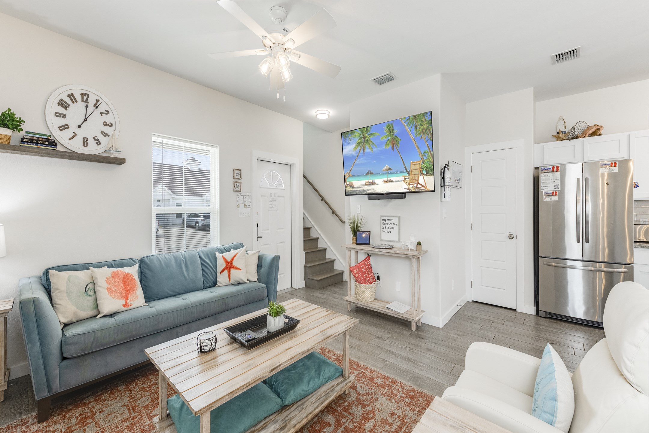 Chic and cozy gathering space with plush seating options and flat screen TV to enjoy 