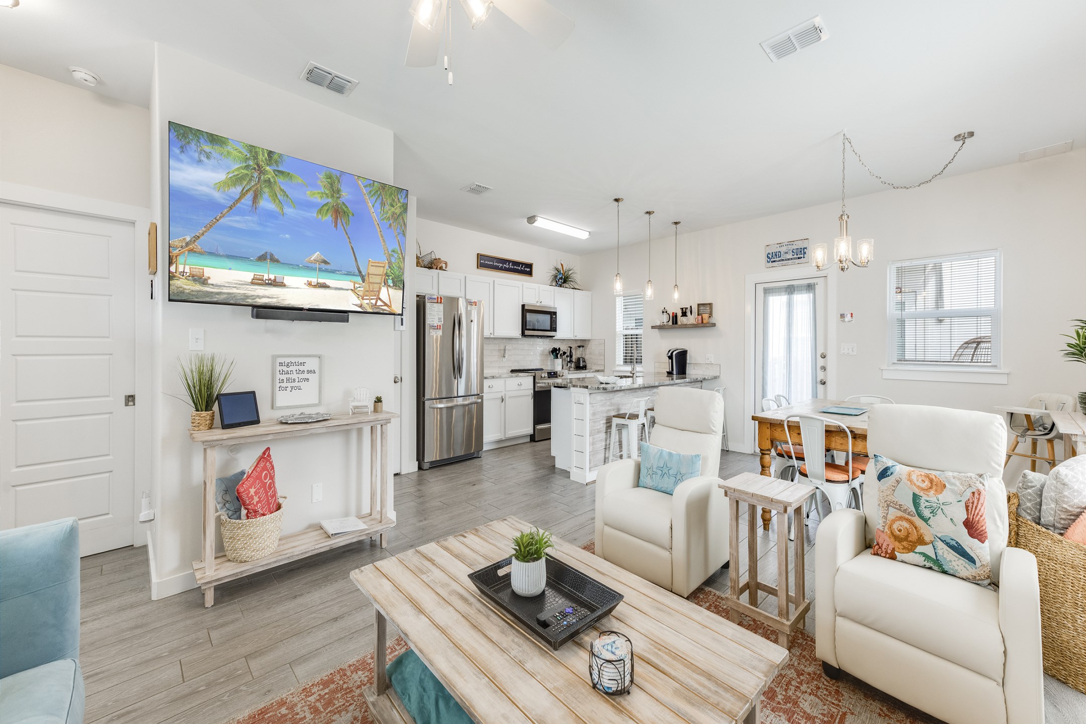 Luxurious open-concept living space featuring contemporary furnishings bathed in natural light