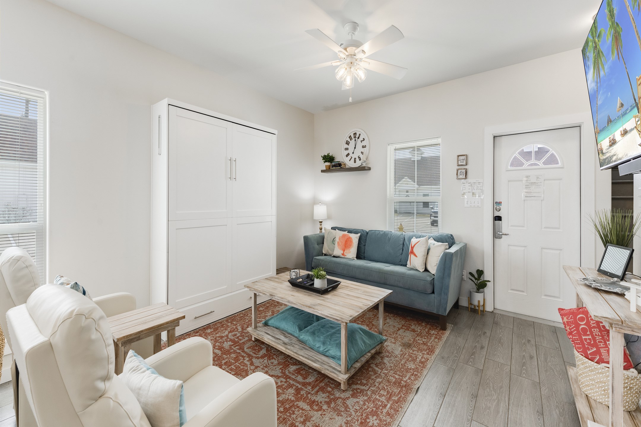 Living area with queen size murphy bed and flat screen TV to enjoy