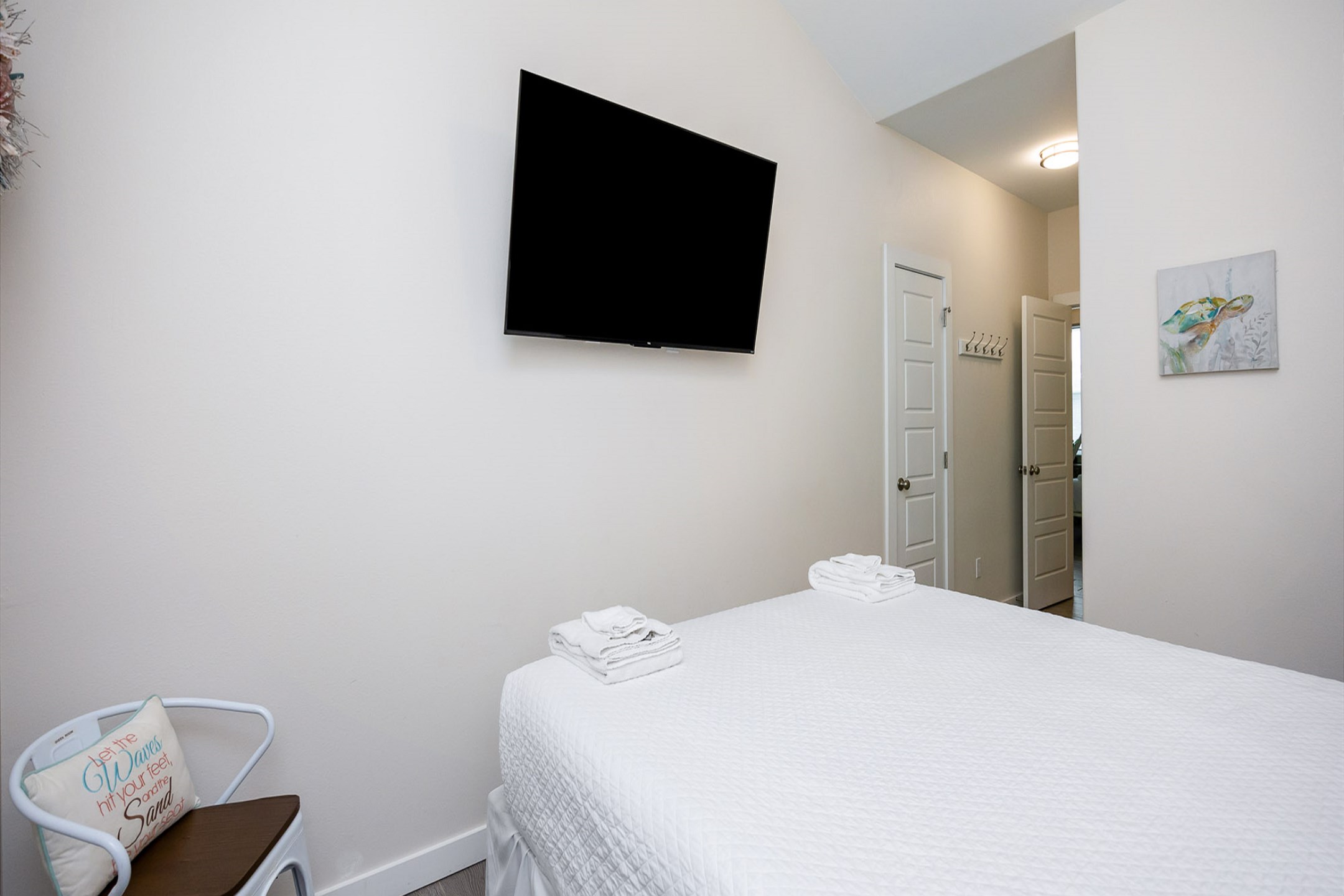 Second bedroom on the second floor with queen size bed and flat screen TV