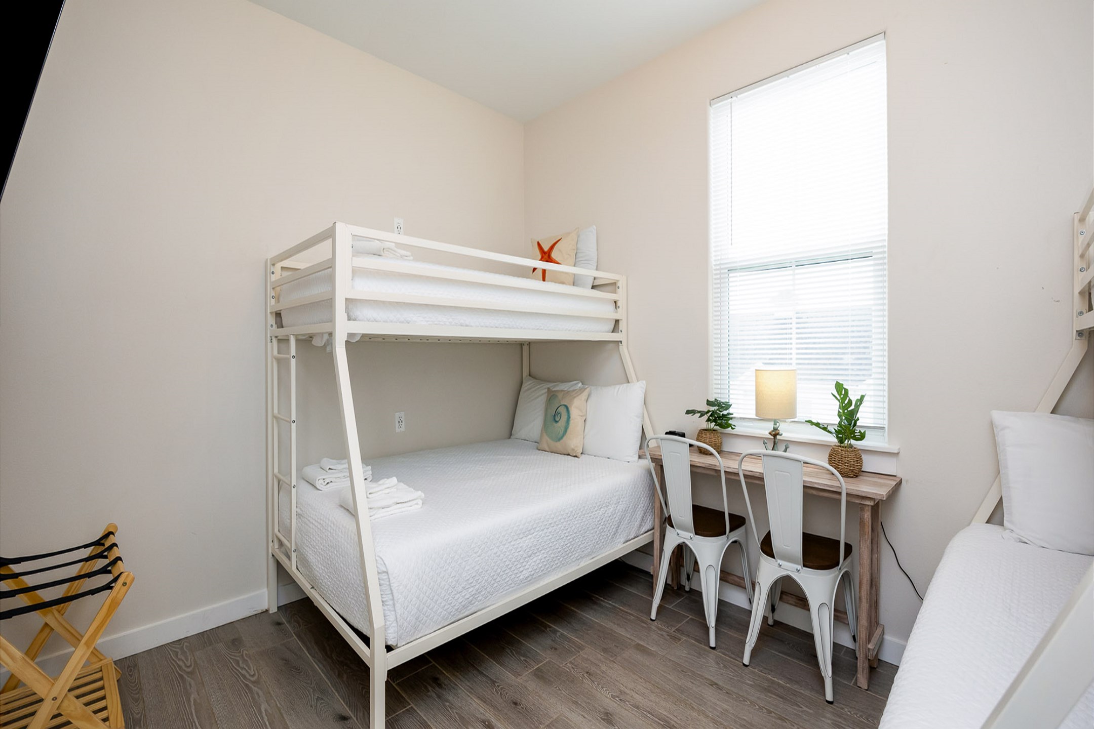 Third bedroom on the second floor with two sets of twin over full size bunk beds, flat screen TV, and dedicated workspace 