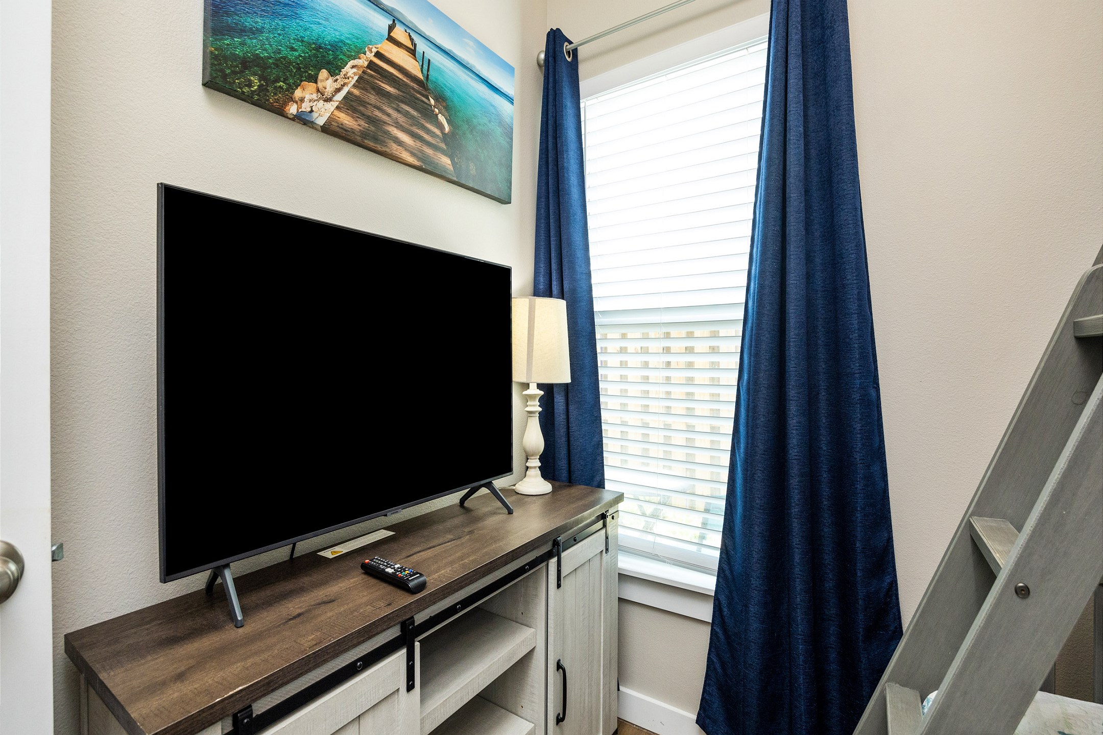 Second bedroom with twin over full size bunk bed and flat screen TV