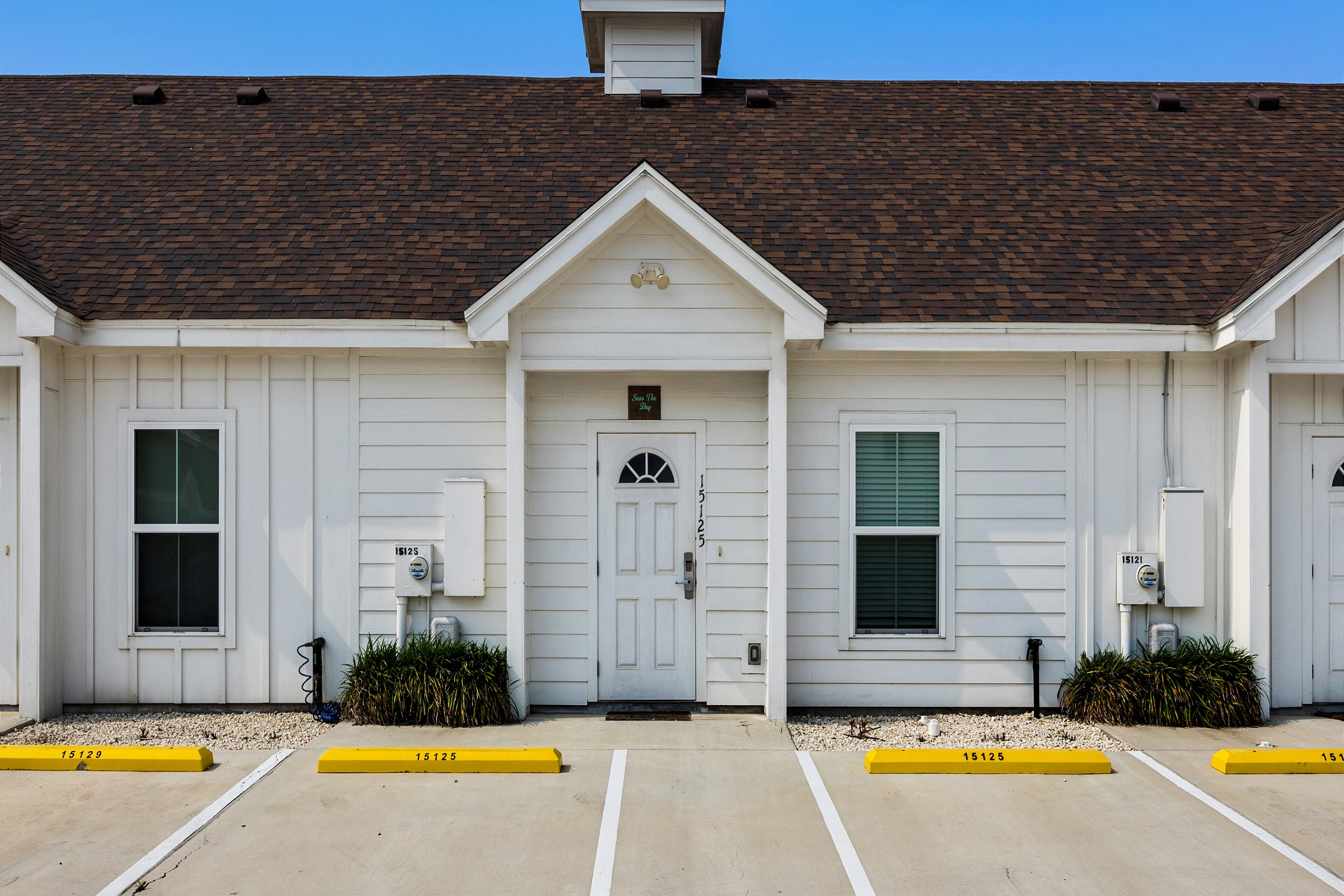 Front entrance to property with two assigned parking spaces