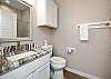 Full bathroom with single sink and walk in shower 