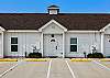 Front entrance to property with two assigned parking spaces