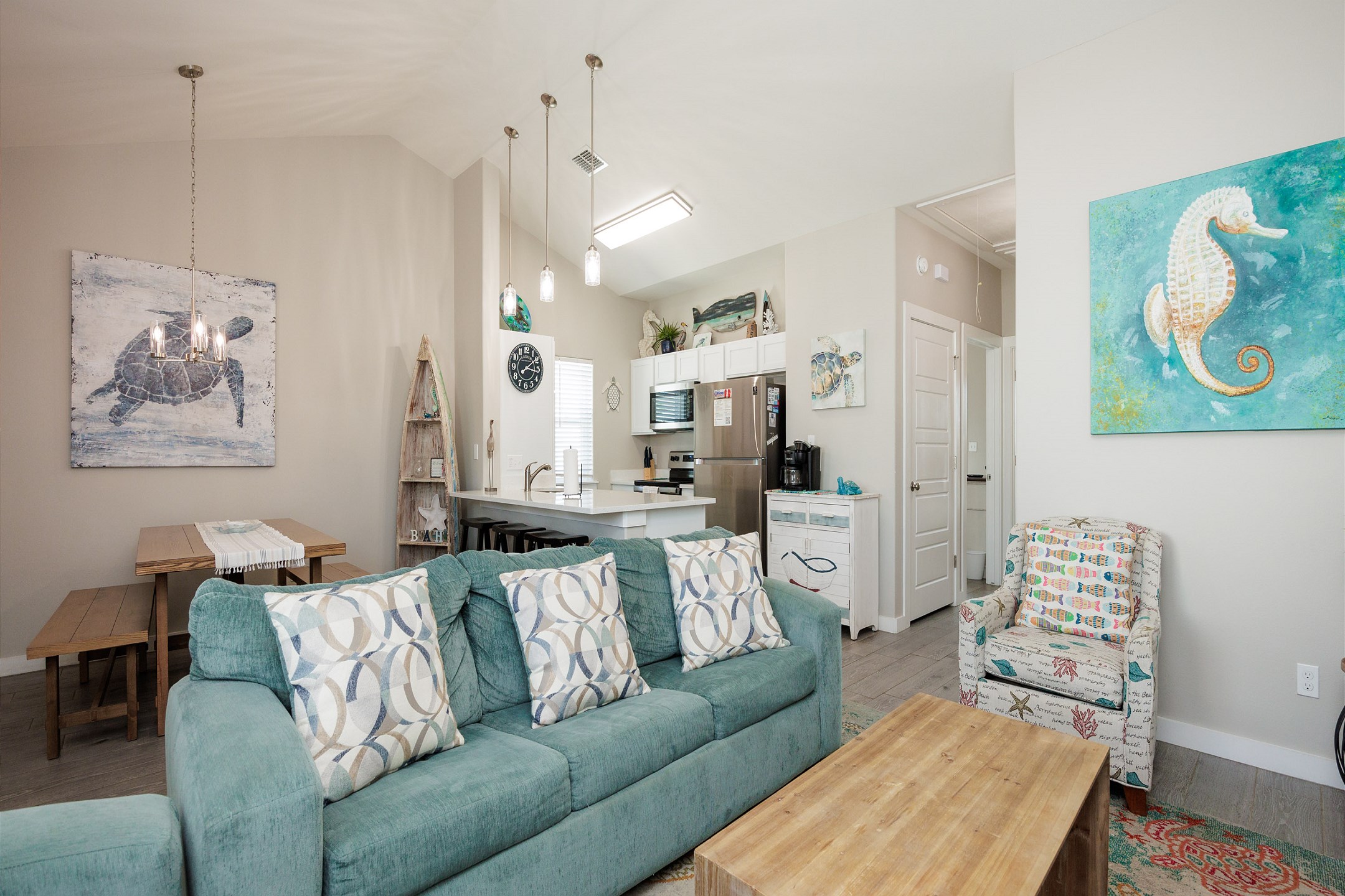 Luxurious open-concept living space featuring contemporary furnishings and bathed in natural light