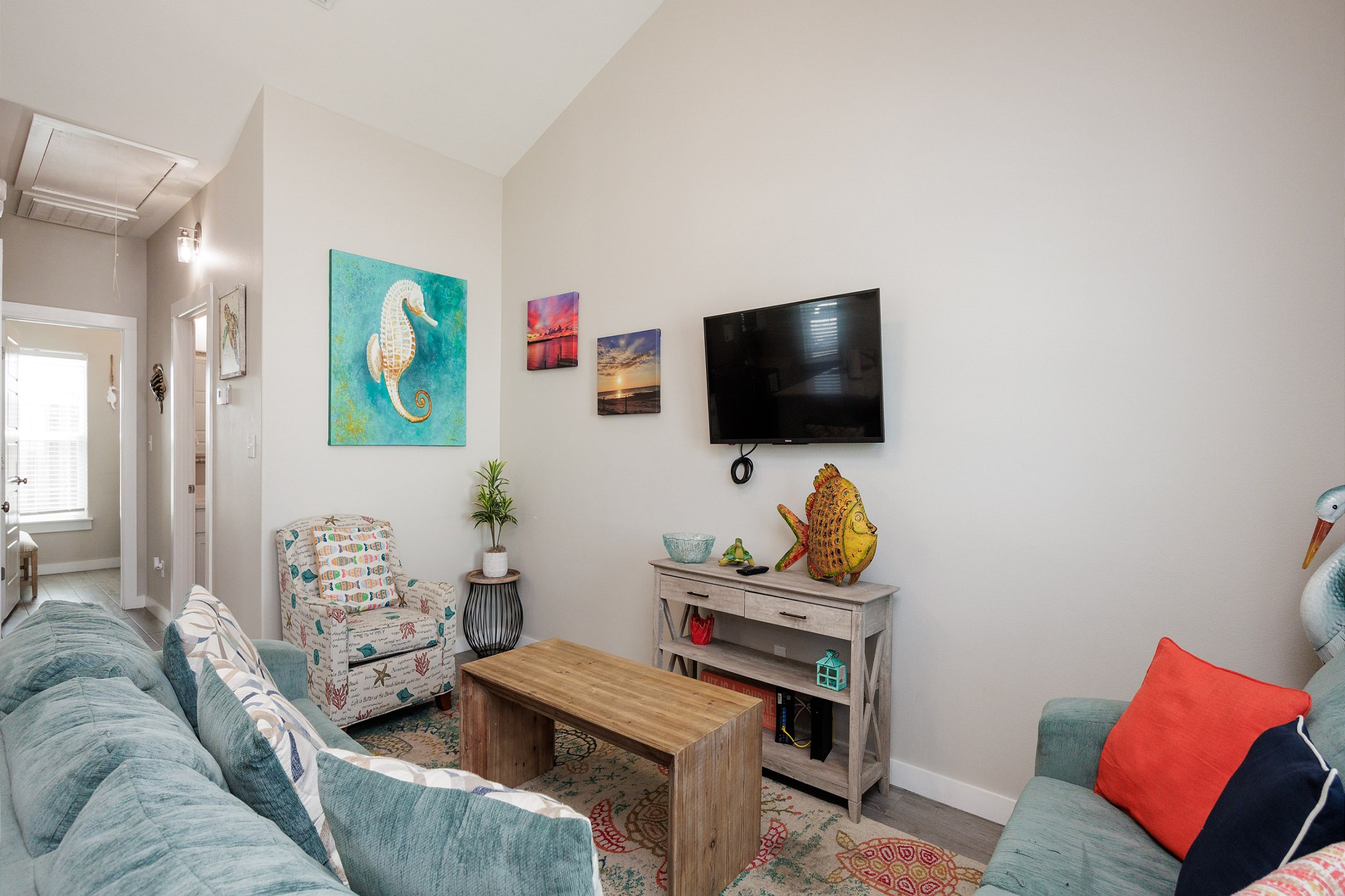 Living area with queen size sleeper sofa, relaxed seating, and flat screen TV 