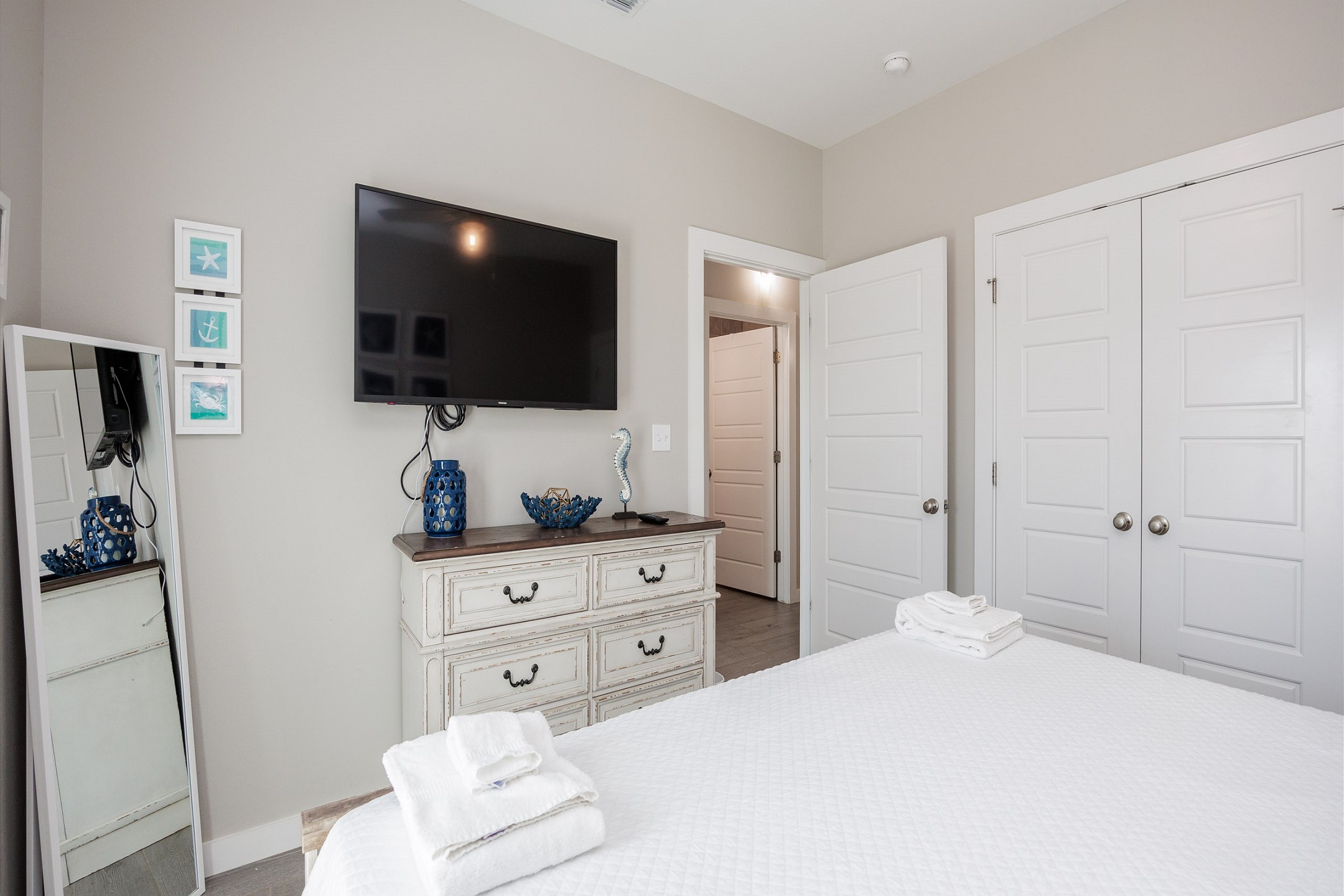 Master bedroom with king size bed, access to the patio and flat screen TV