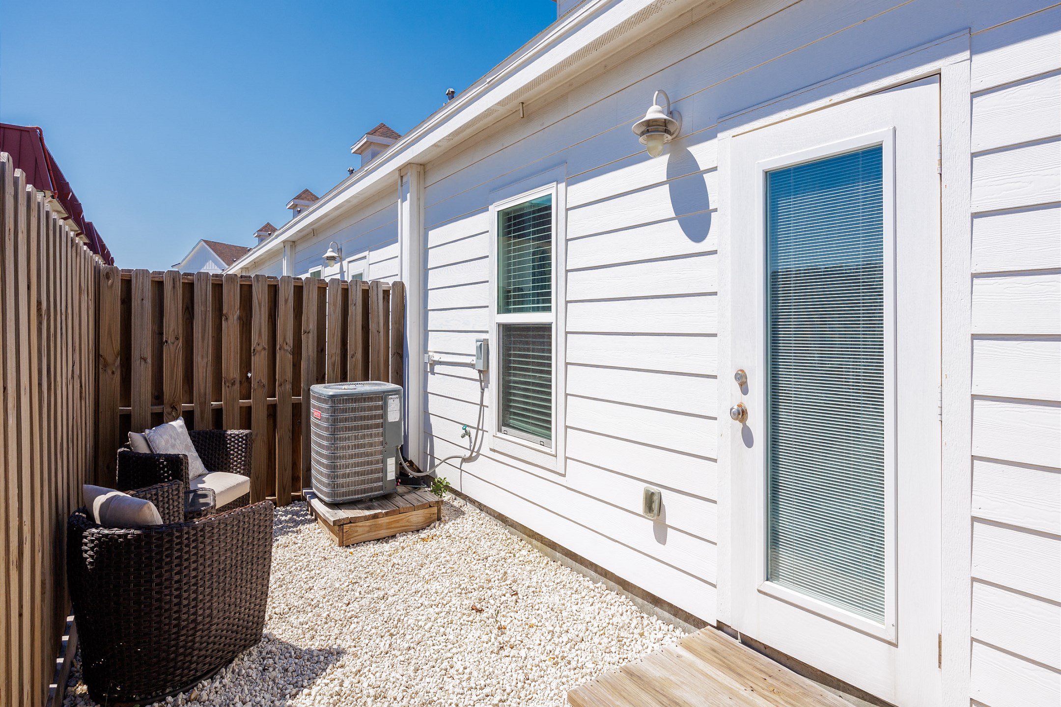Private back patio with cozy seating