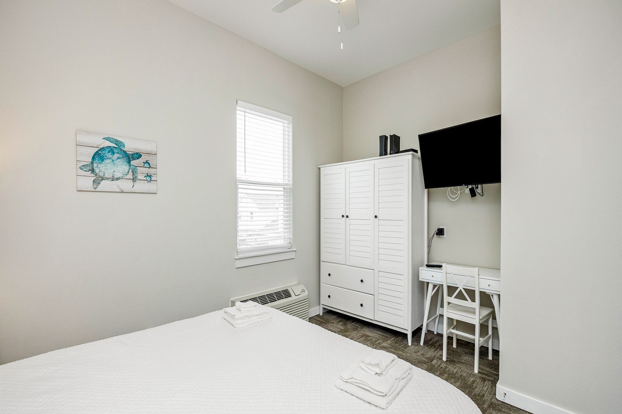 Master bedroom with king size bed and flat screen TV