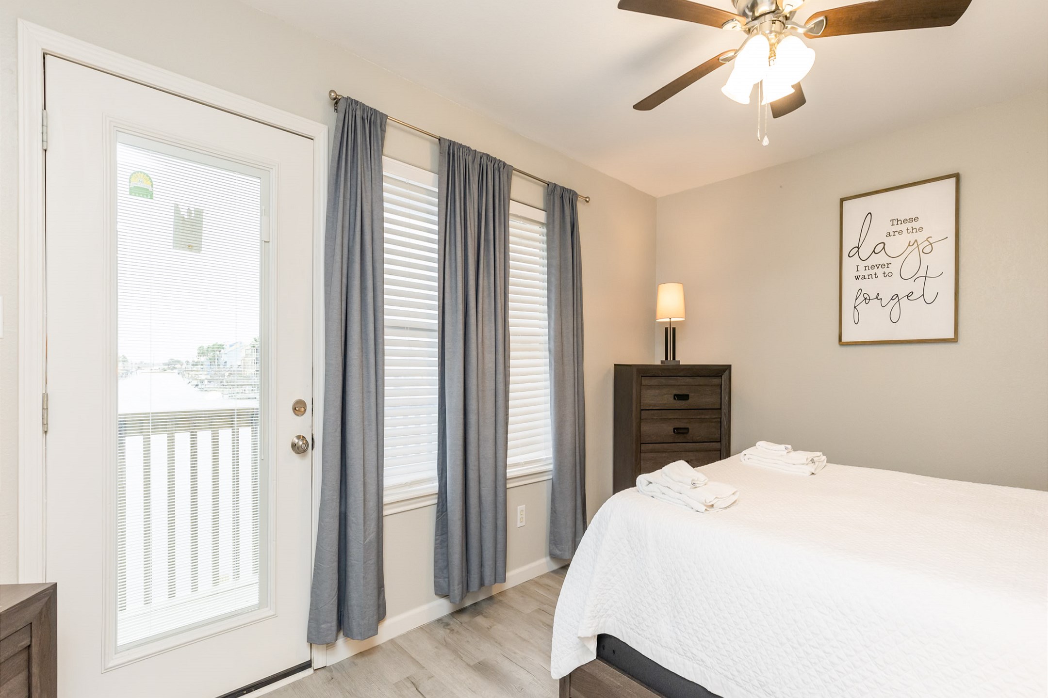 Master bedroom on the second floor with queen size bed, private balcony, ensuite bathroom and flat screen TV