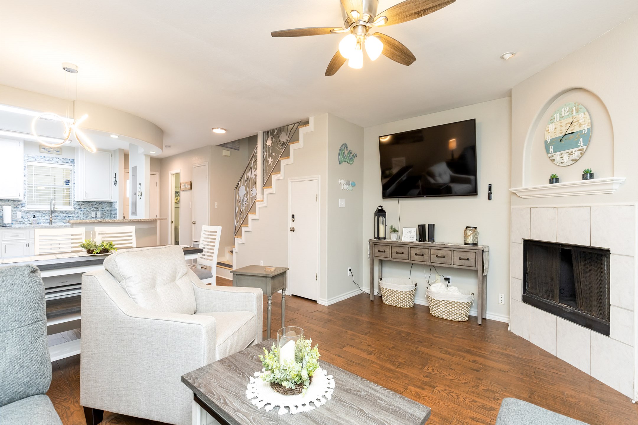 The kitchen, dining, and living areas blend together seamlessly for a bright and airy feel