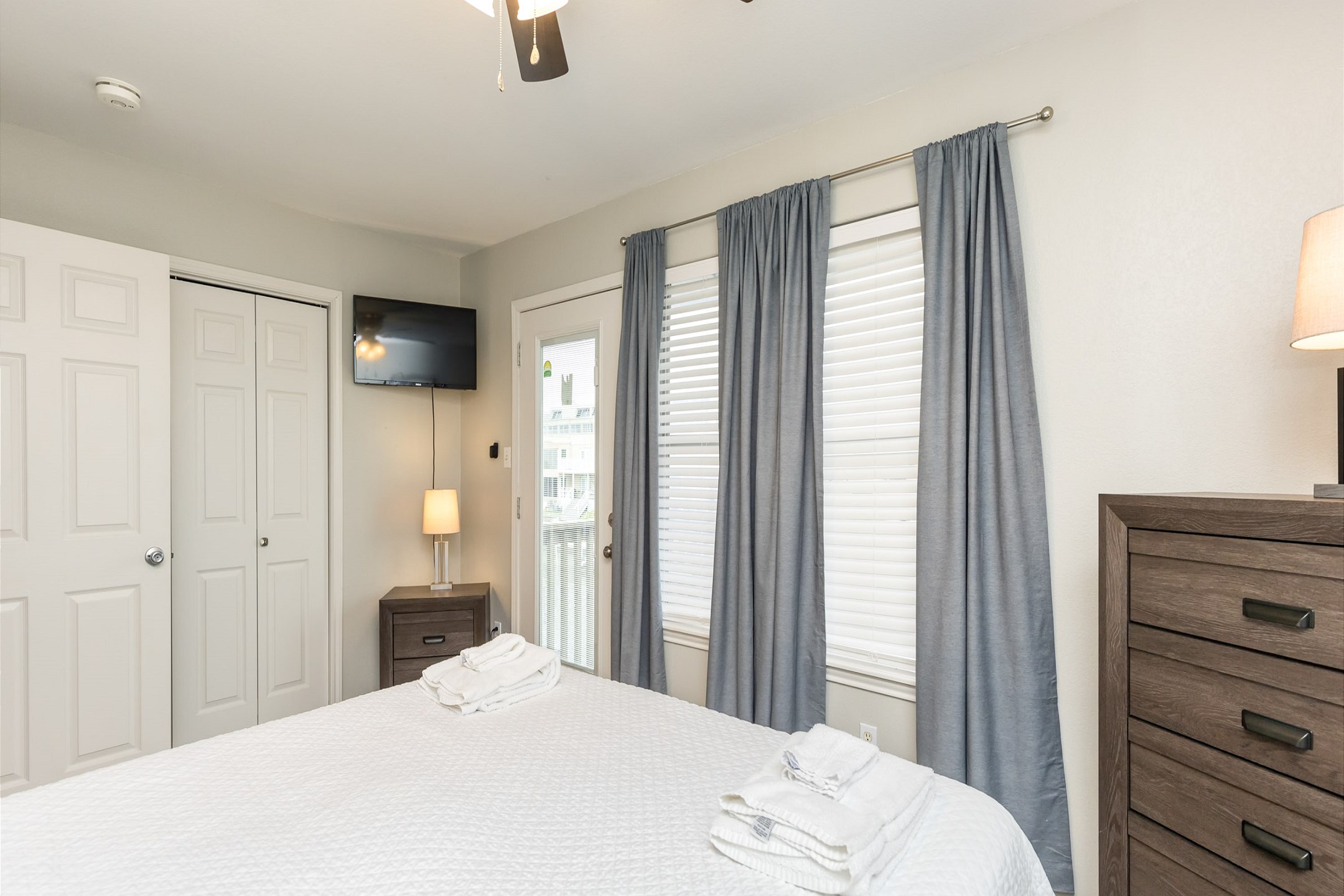 Master bedroom on the second floor with queen size bed, private balcony, ensuite bathroom and flat screen TV