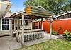 Fun outdoor bar with seating, a sink, and a grill?perfect for relaxing and entertaining!
