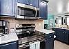 Fully stocked kitchen with stainless steel appliances 