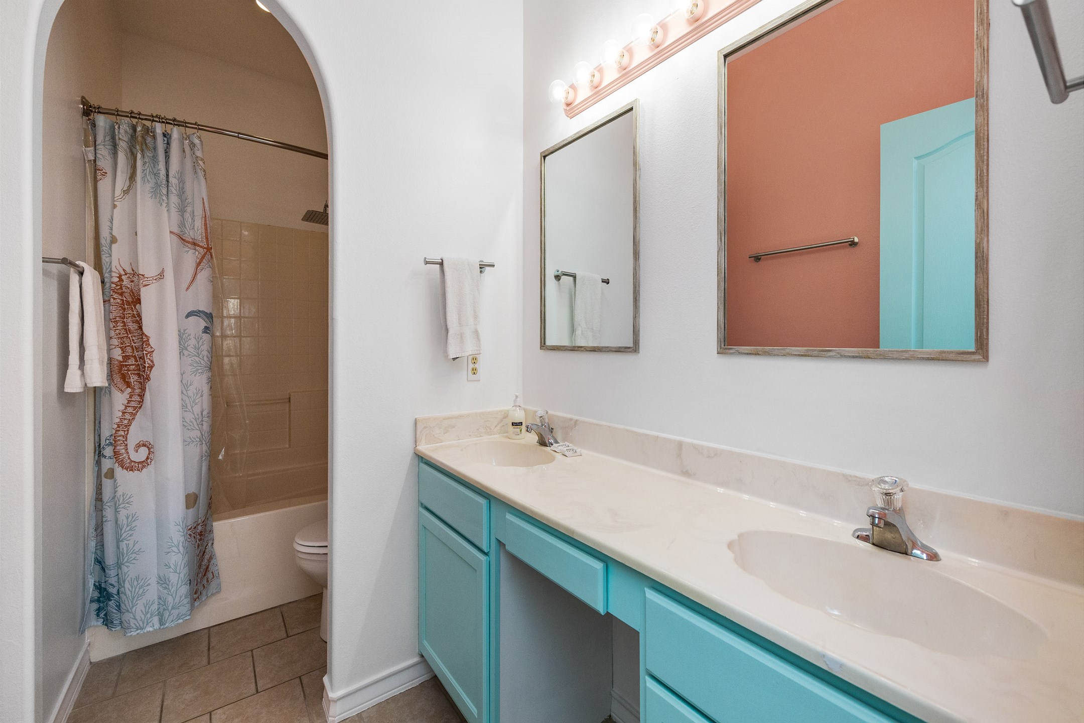 Second floor bathroom with tub/shower combo and double sinks 