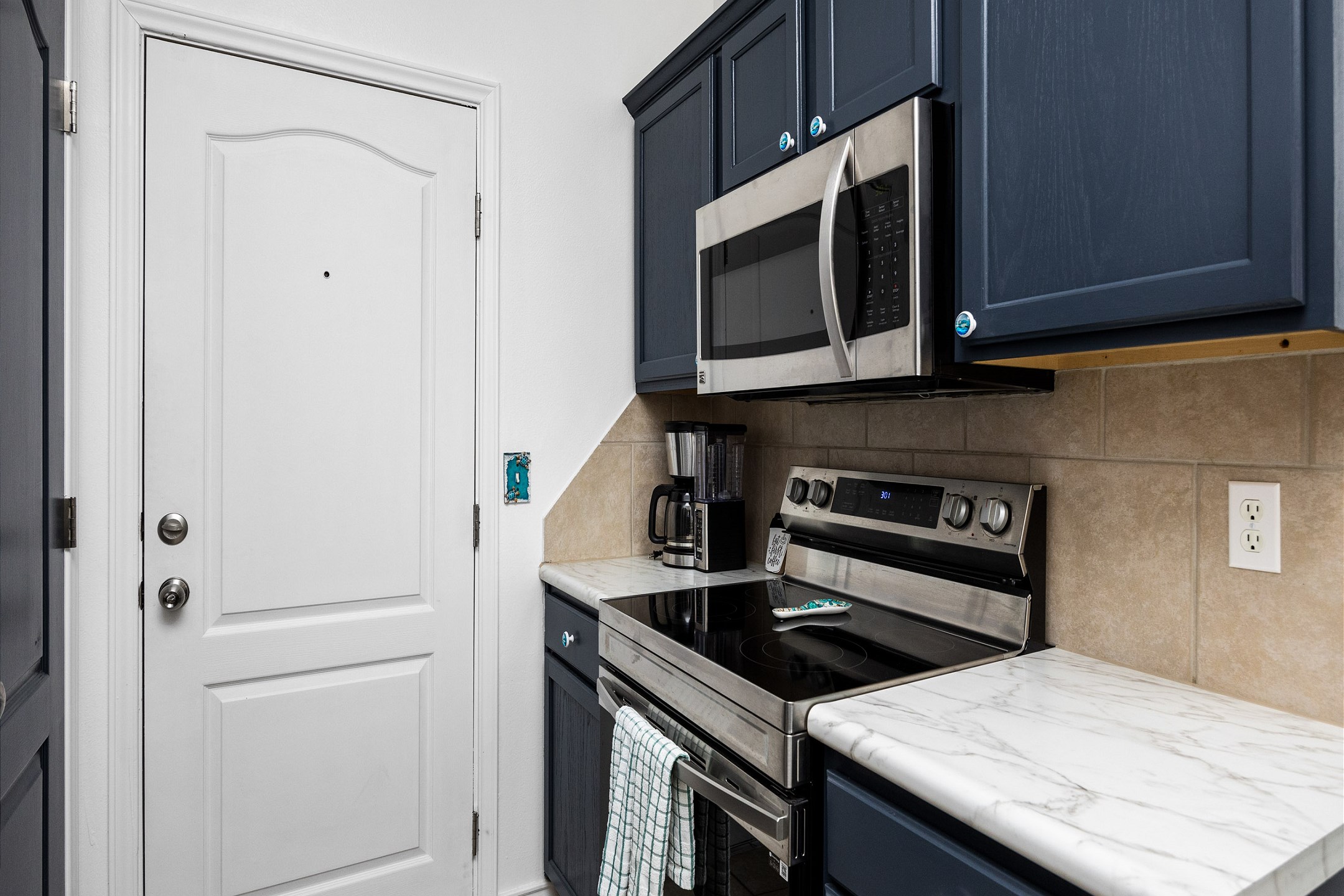 Culinary Haven: Cook up seaside delights in the fully equipped kitchen with modern appliances and plenty of counter space