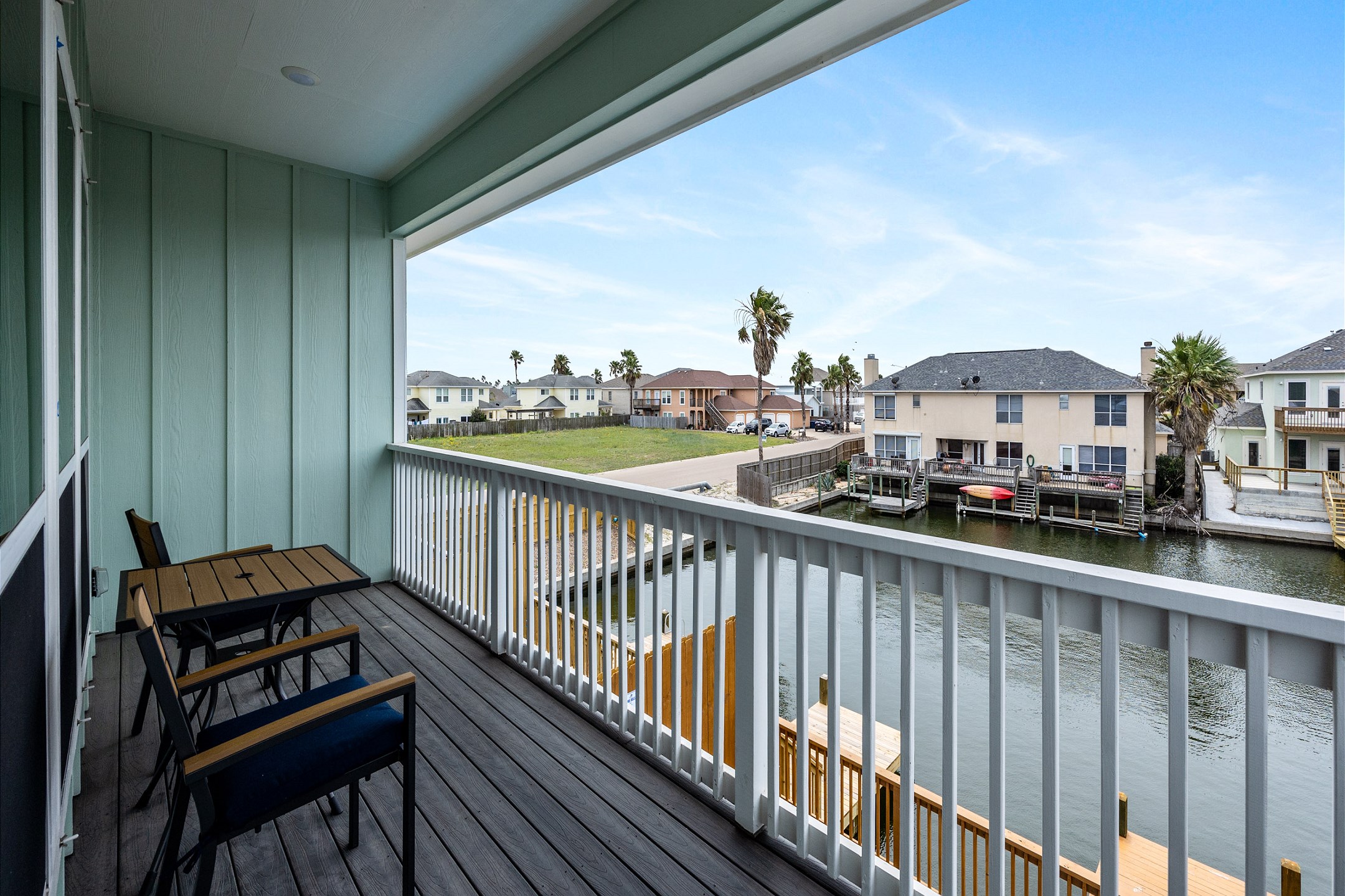 Balcony off of master bedroom with views of the canal