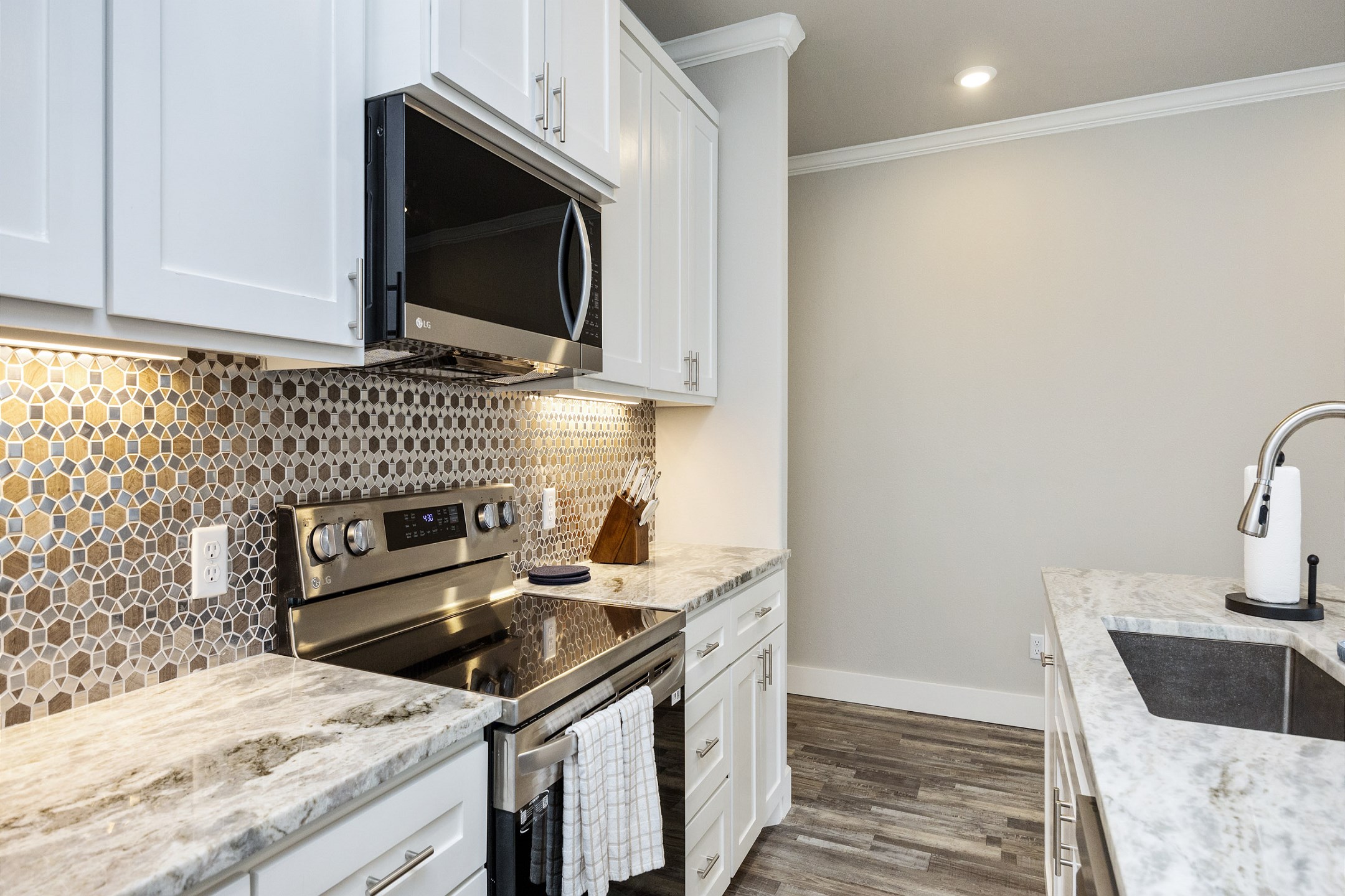 Fully equipped kitchen with stainless steel appliances for gourmet cooking