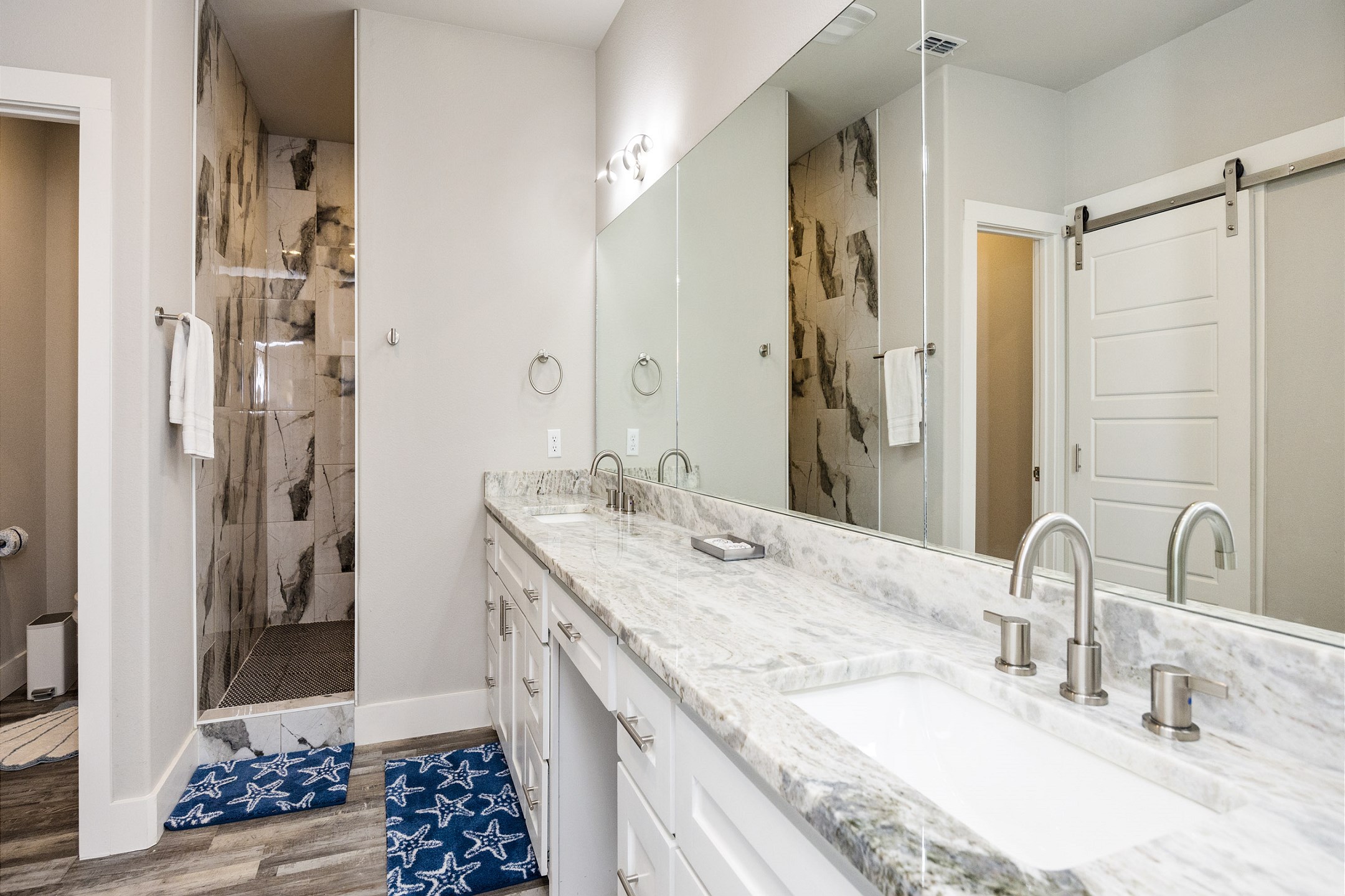 Master bathroom with double sinks and walk-in shower 