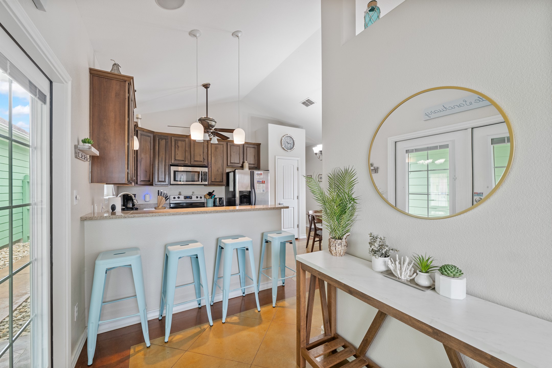 Stylish entry leads into kitchen with bar seating for 4
