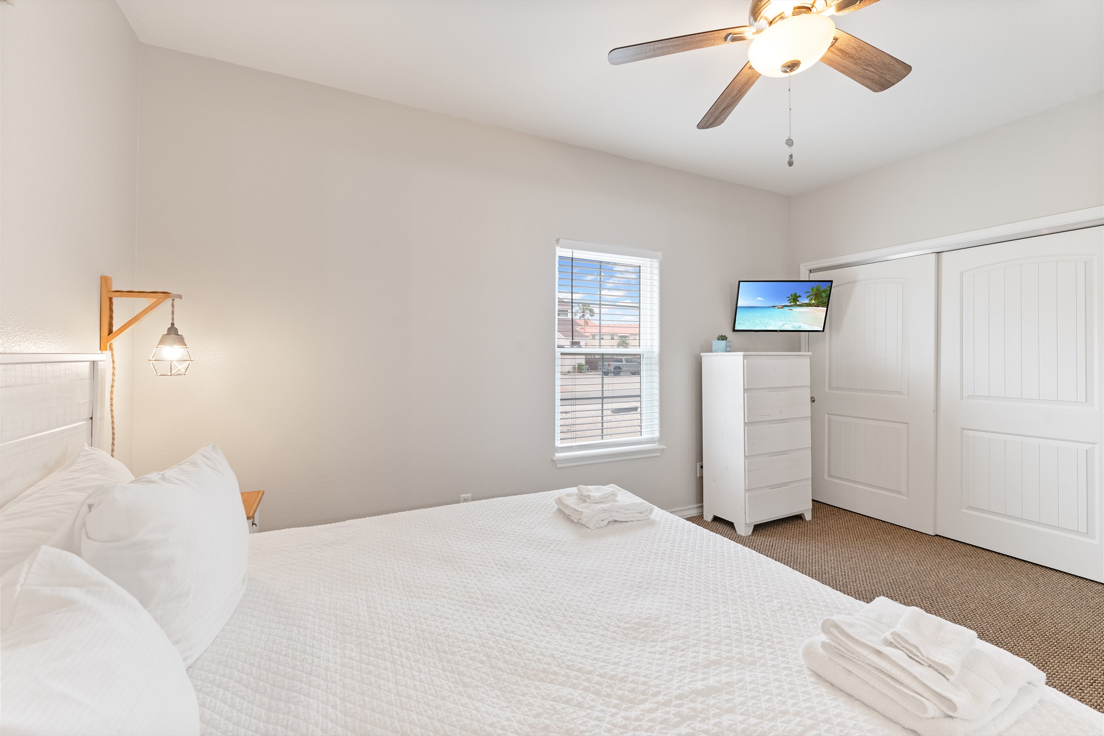 Unwind in this light and open master with comfy king size bed