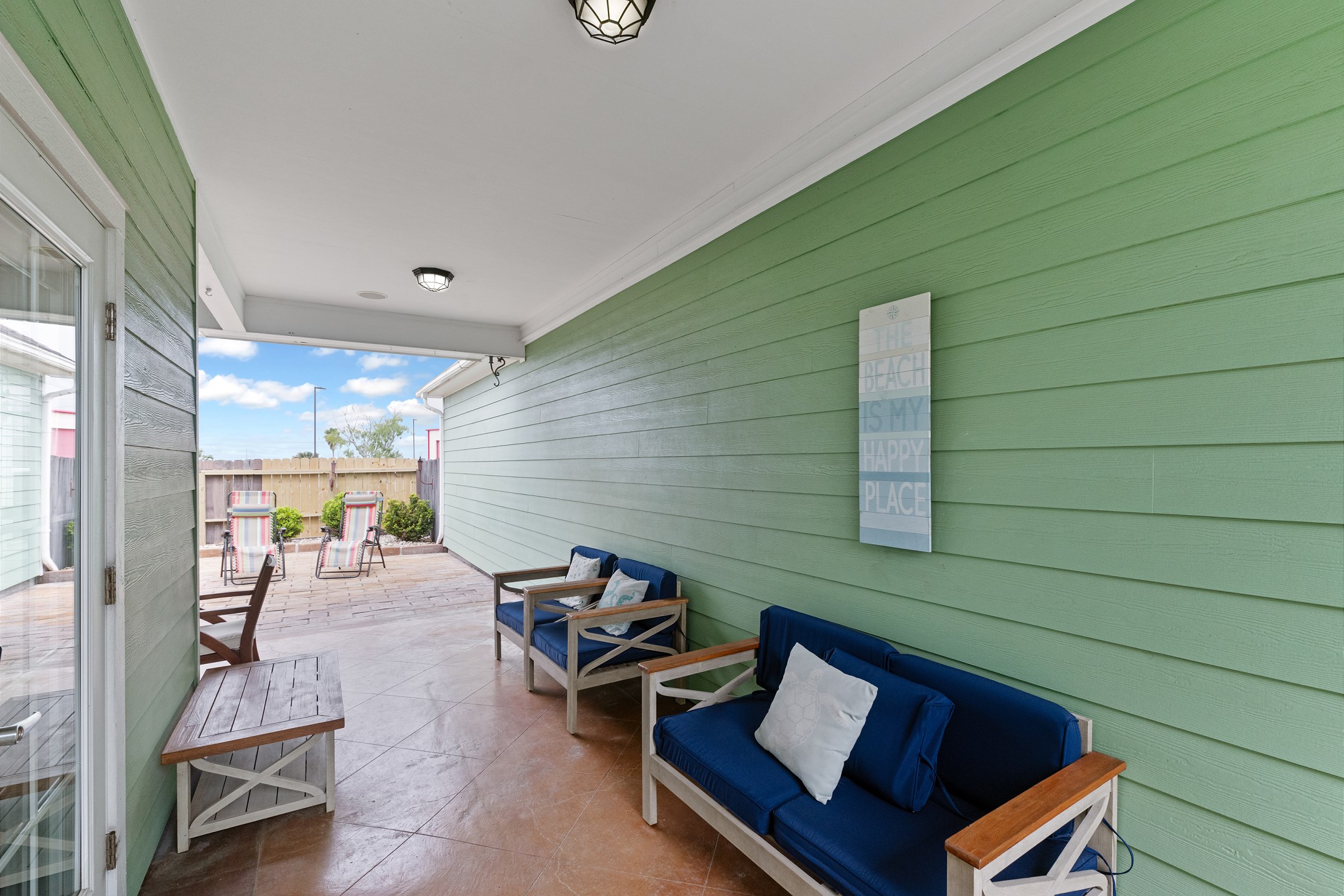 Enjoy the breeze and plenty of seating while relaxing on the private patio 