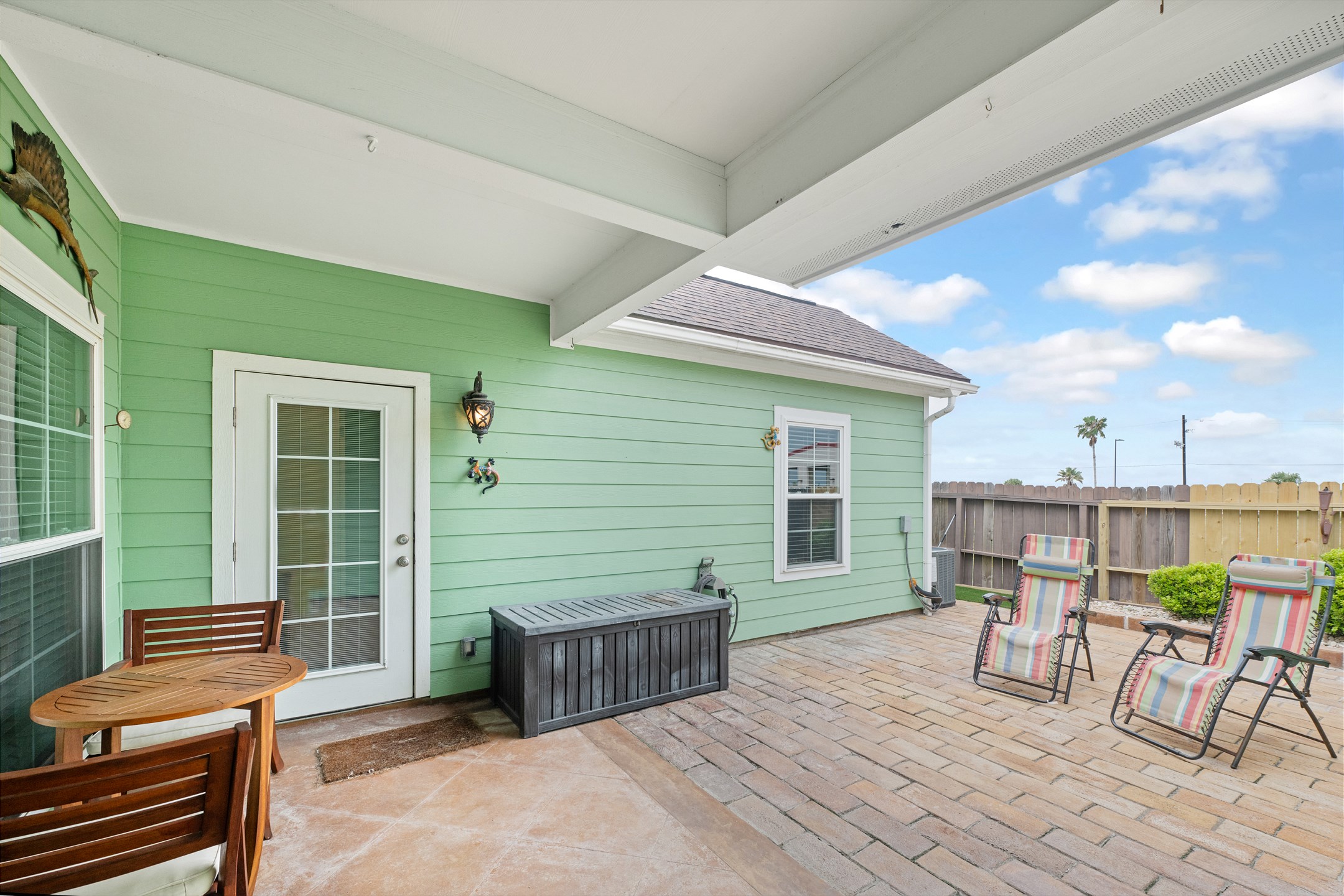 Relax in the paved backyard area—perfect for morning coffee or evening drinks