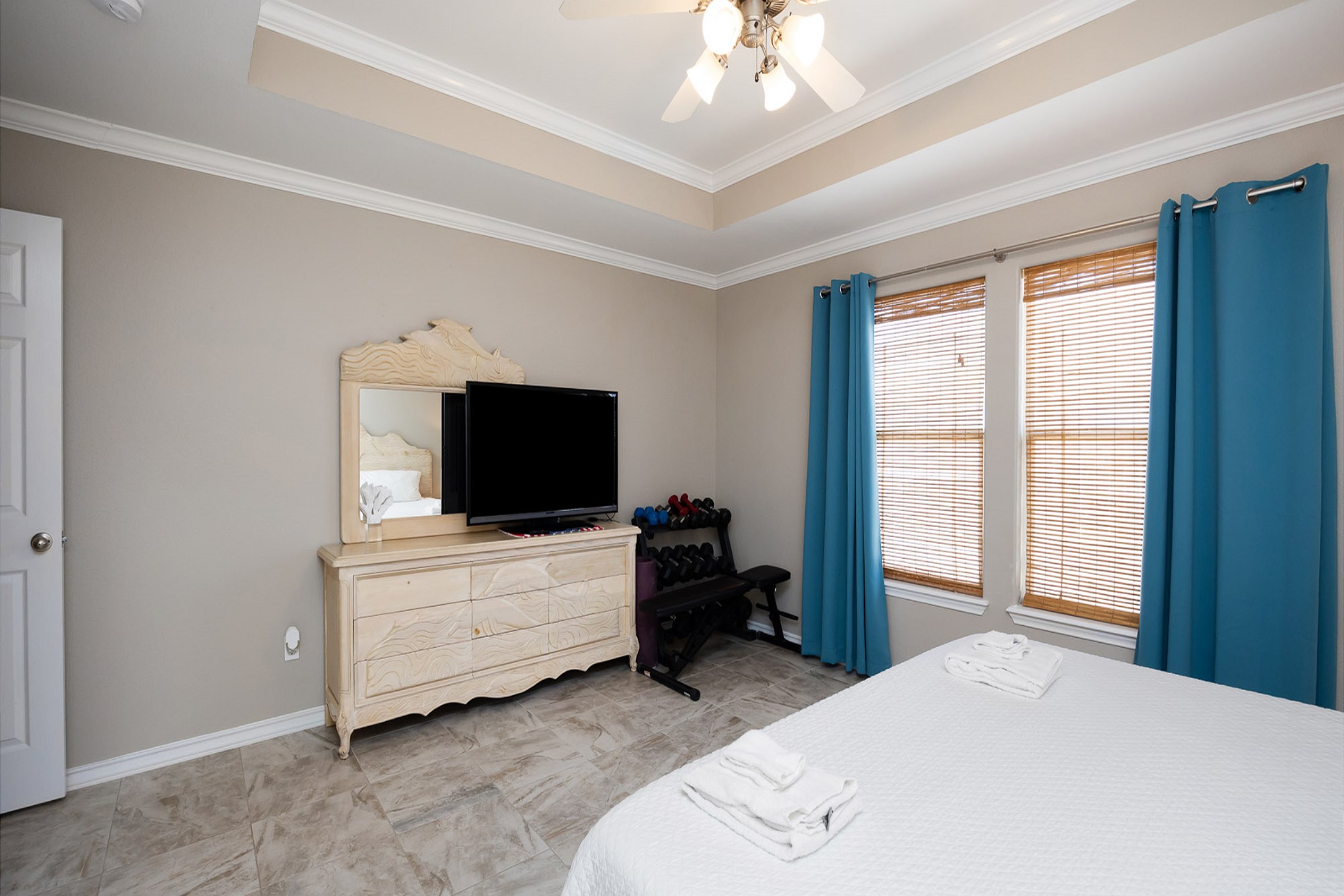Master bedroom with king size bed and flat screen TV