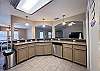 Fully equipped kitchen with plenty of counter space for cooking