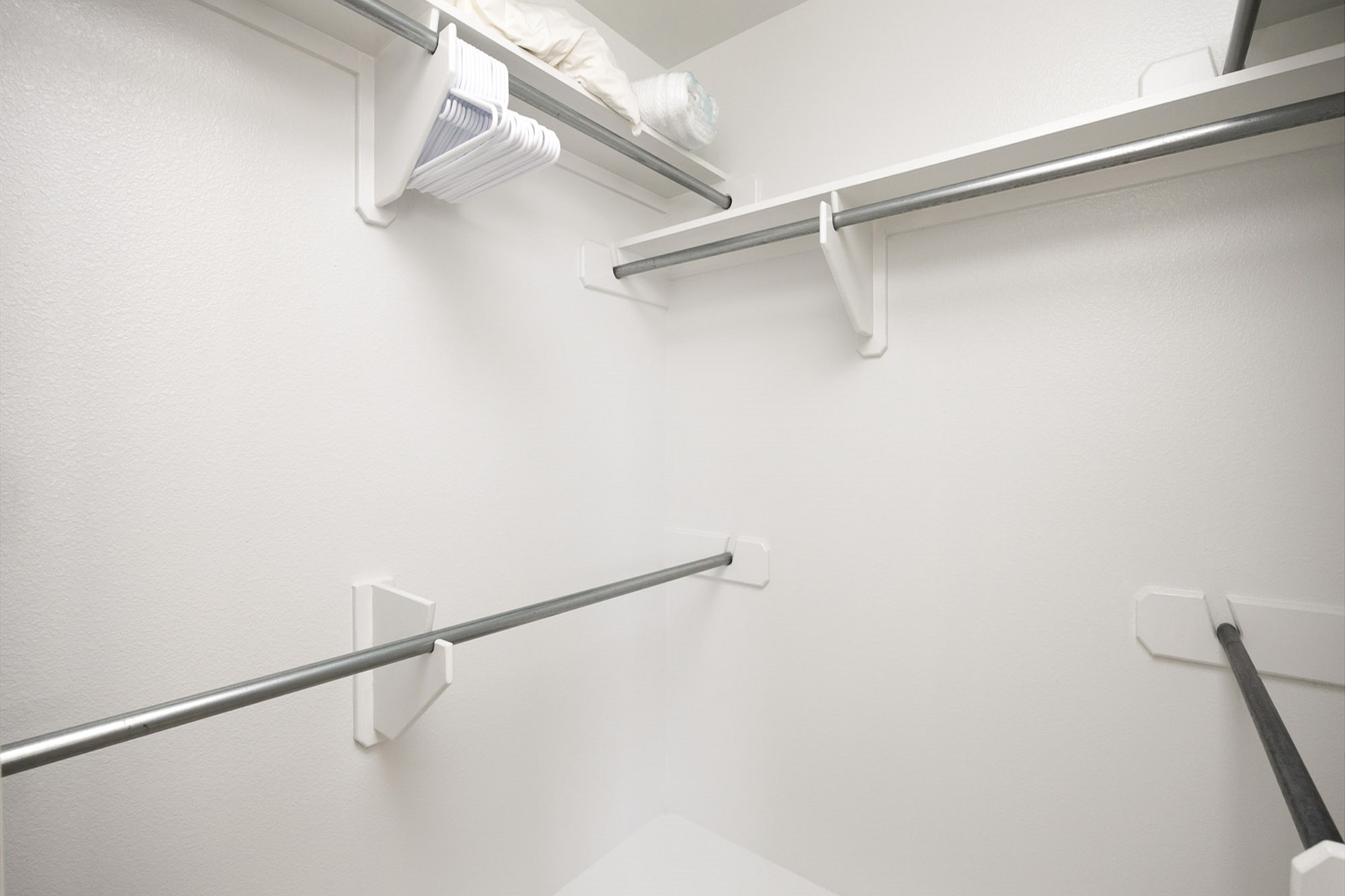 The guest bedroom features a spacious closet, providing generous storage for all your essentials