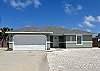 Front view of property with garage and driveway parking