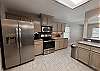 Fully equipped kitchen with stainless steel appliances and plenty of storage space