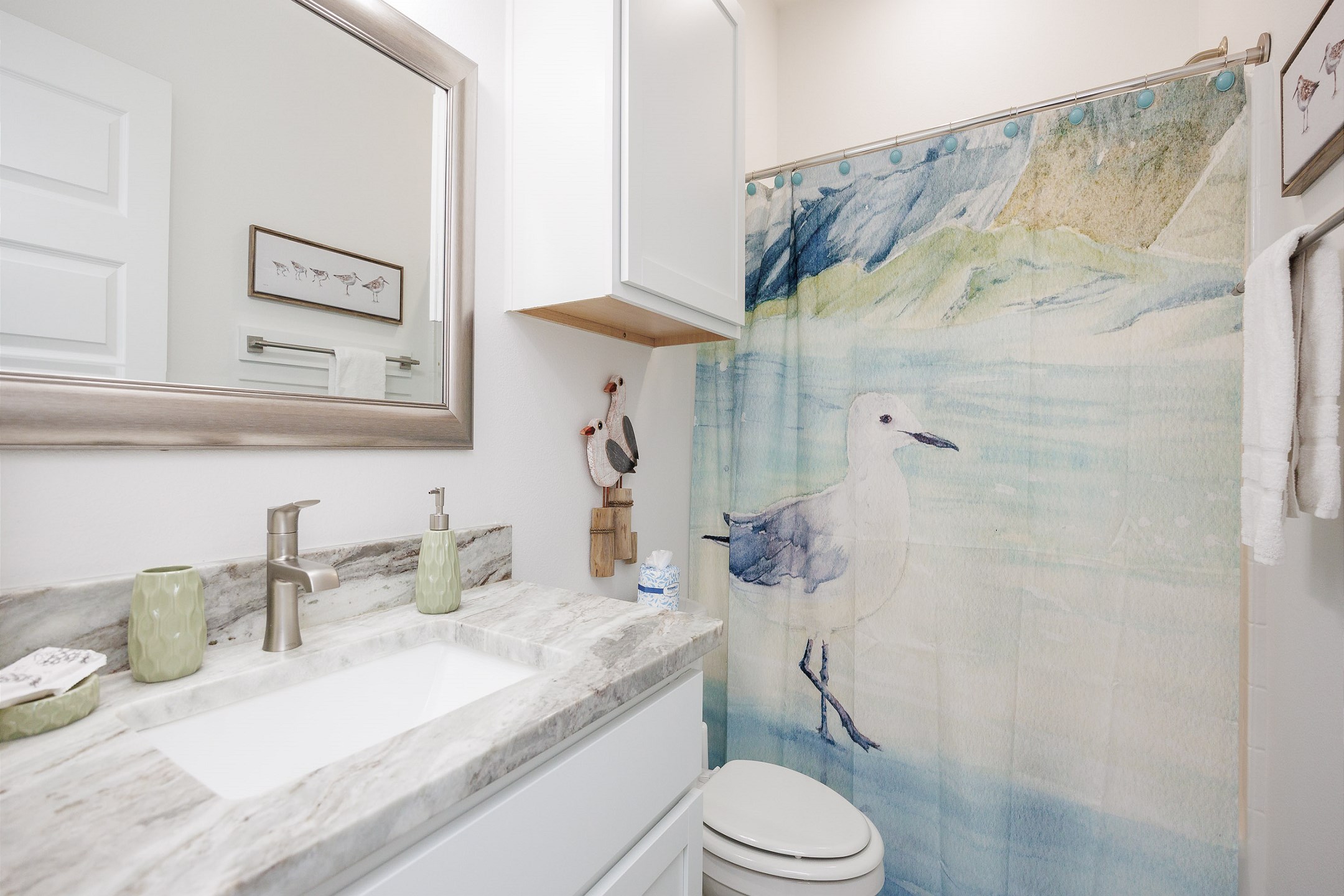 Guest bathroom on the second floor with tub and shower combo