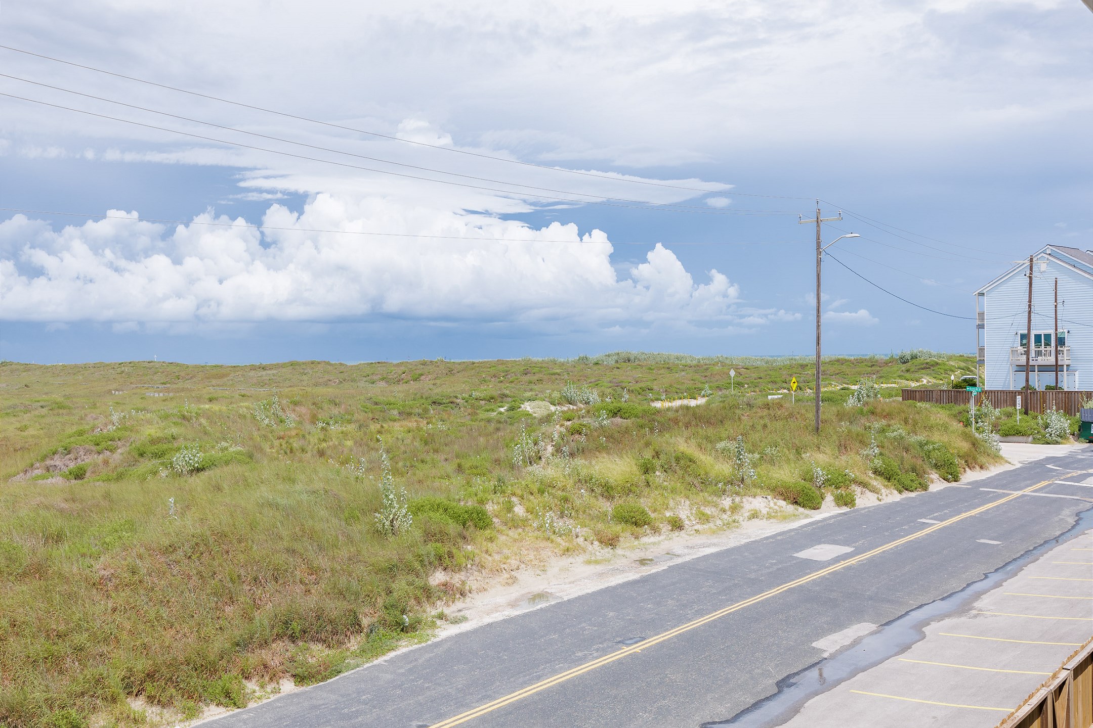 Private, balcony off the second bedroom with chairs and Island views 