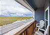 Private balcony off the second bedroom with chairs and Island views 