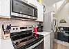 Fully equipped kitchen with stainless steel appliances, beautiful counter tops and coffee maker 