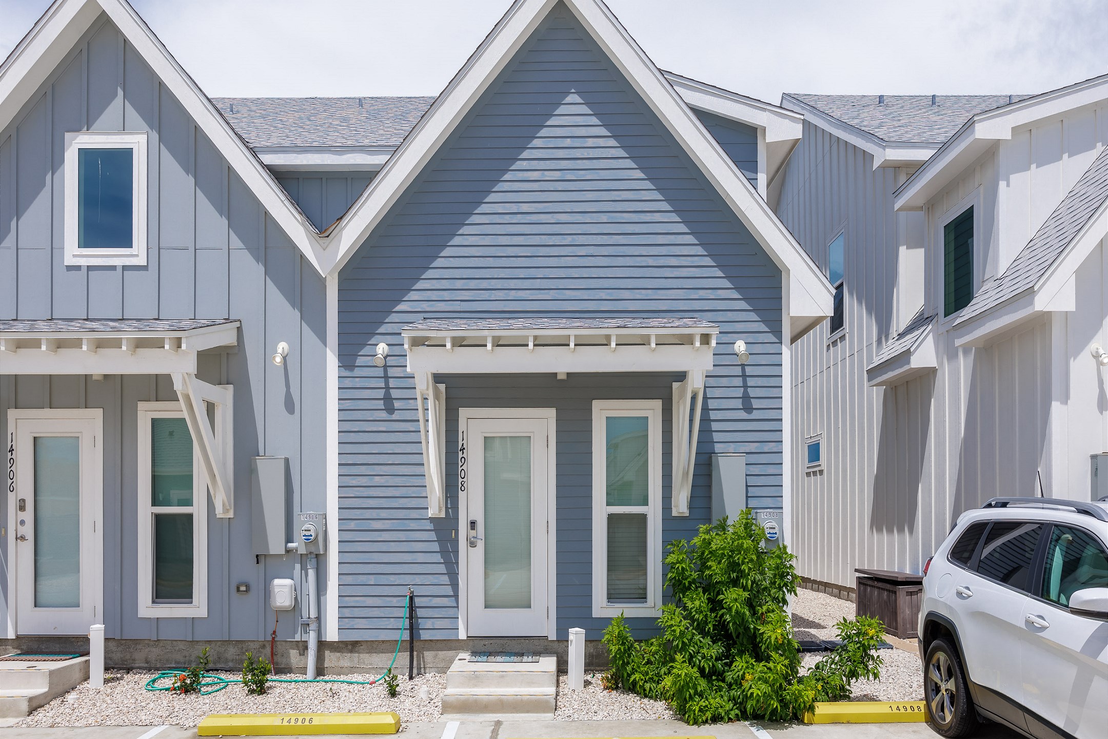 Two reserved parking spots labeled in front of property entrance 