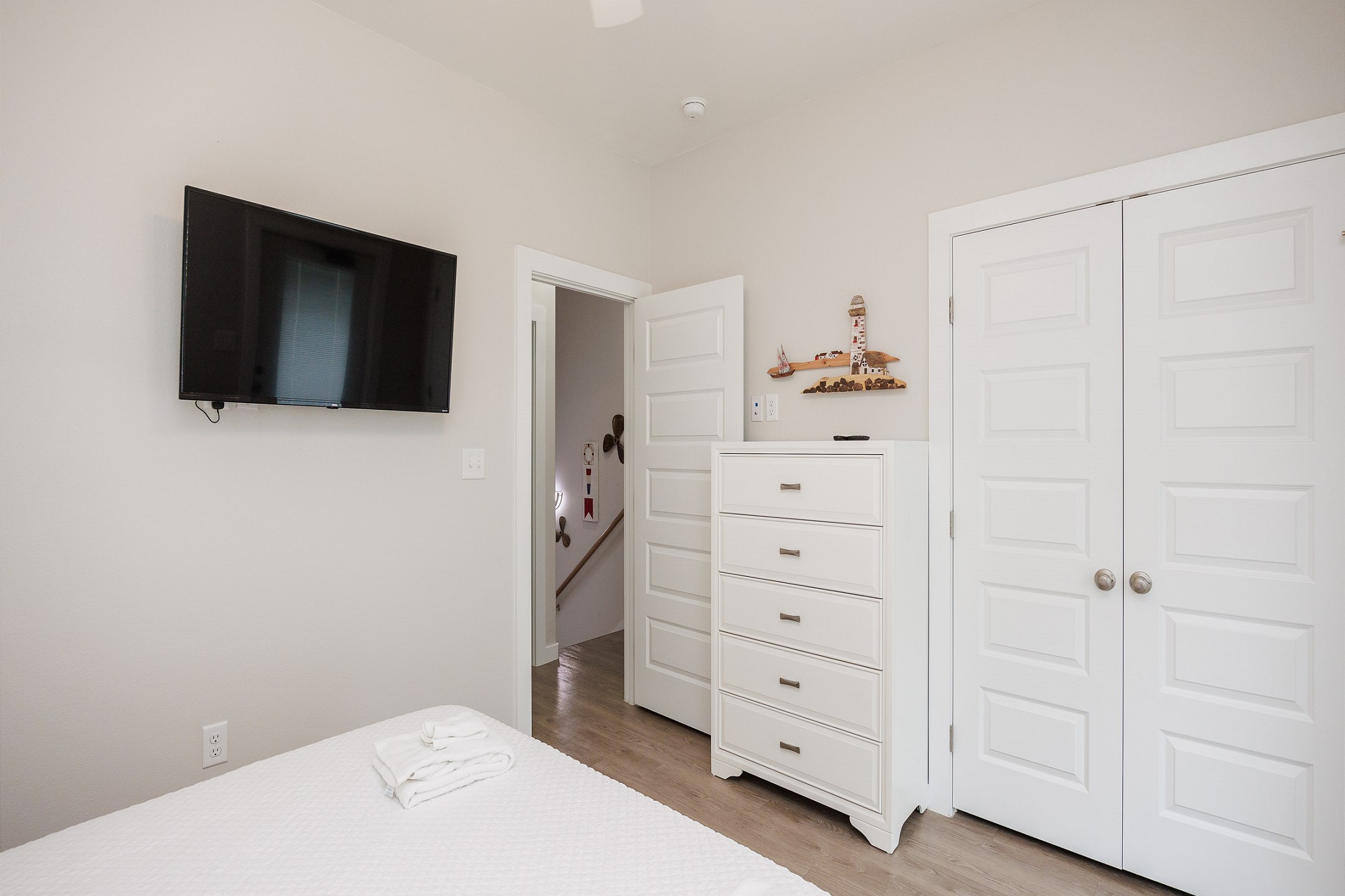 Second bedroom on the second floor with a king size bed, access to the private balcony, and a flat screen TV 