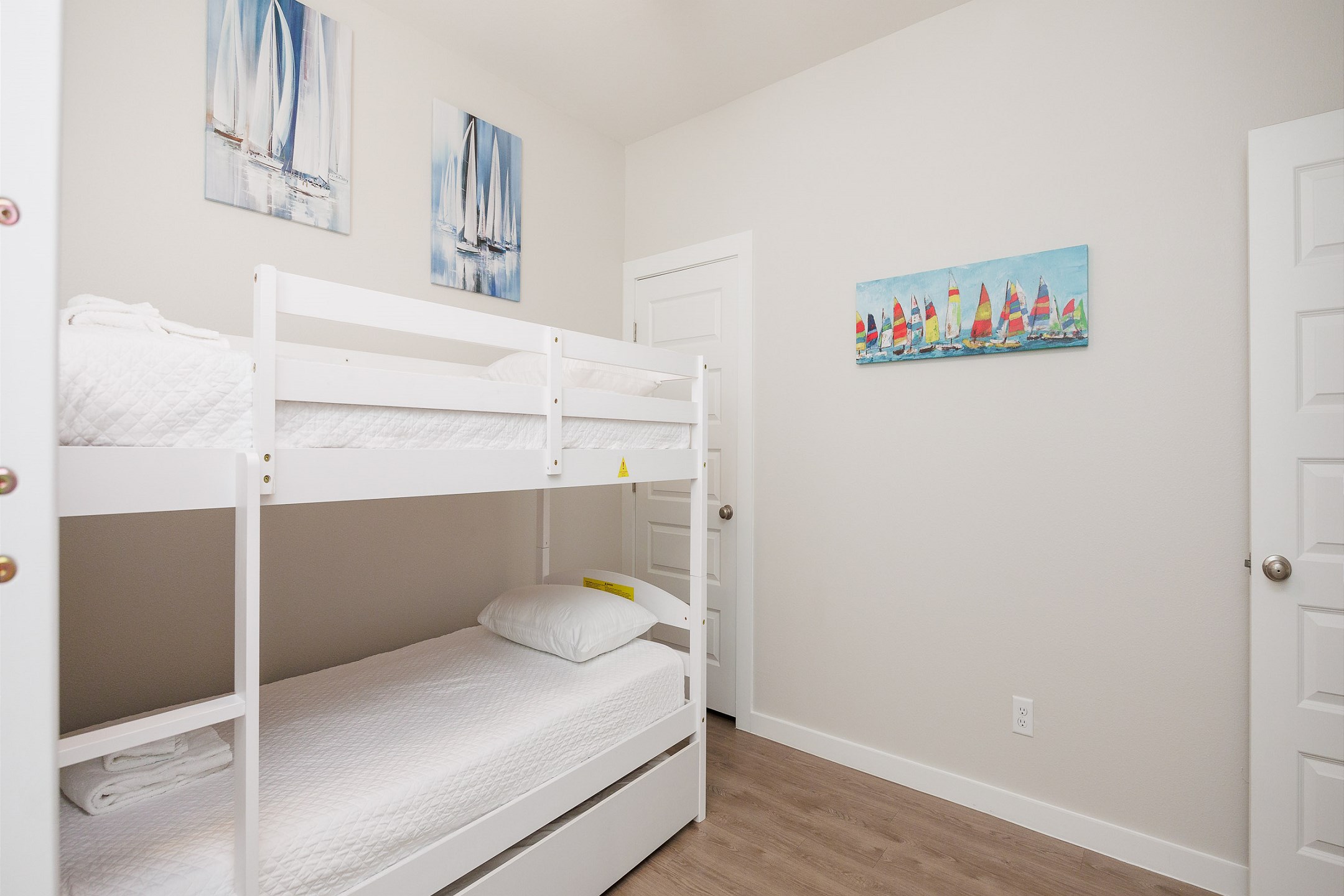 Third bedroom on the second floor with two sets of twin size bunk beds, one twin trundle bed, and a flat screen TV 