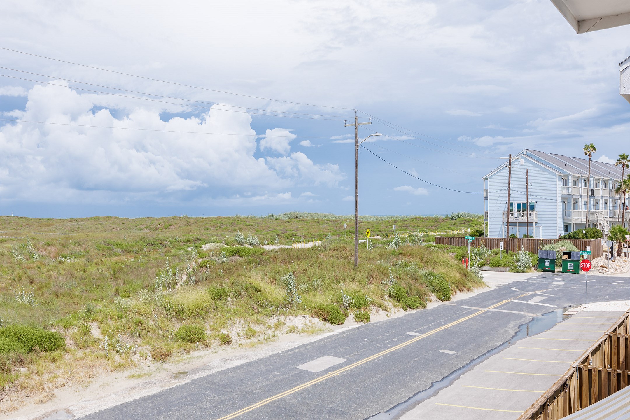 View of the coastal dunes and the sound of waves crashing onshore