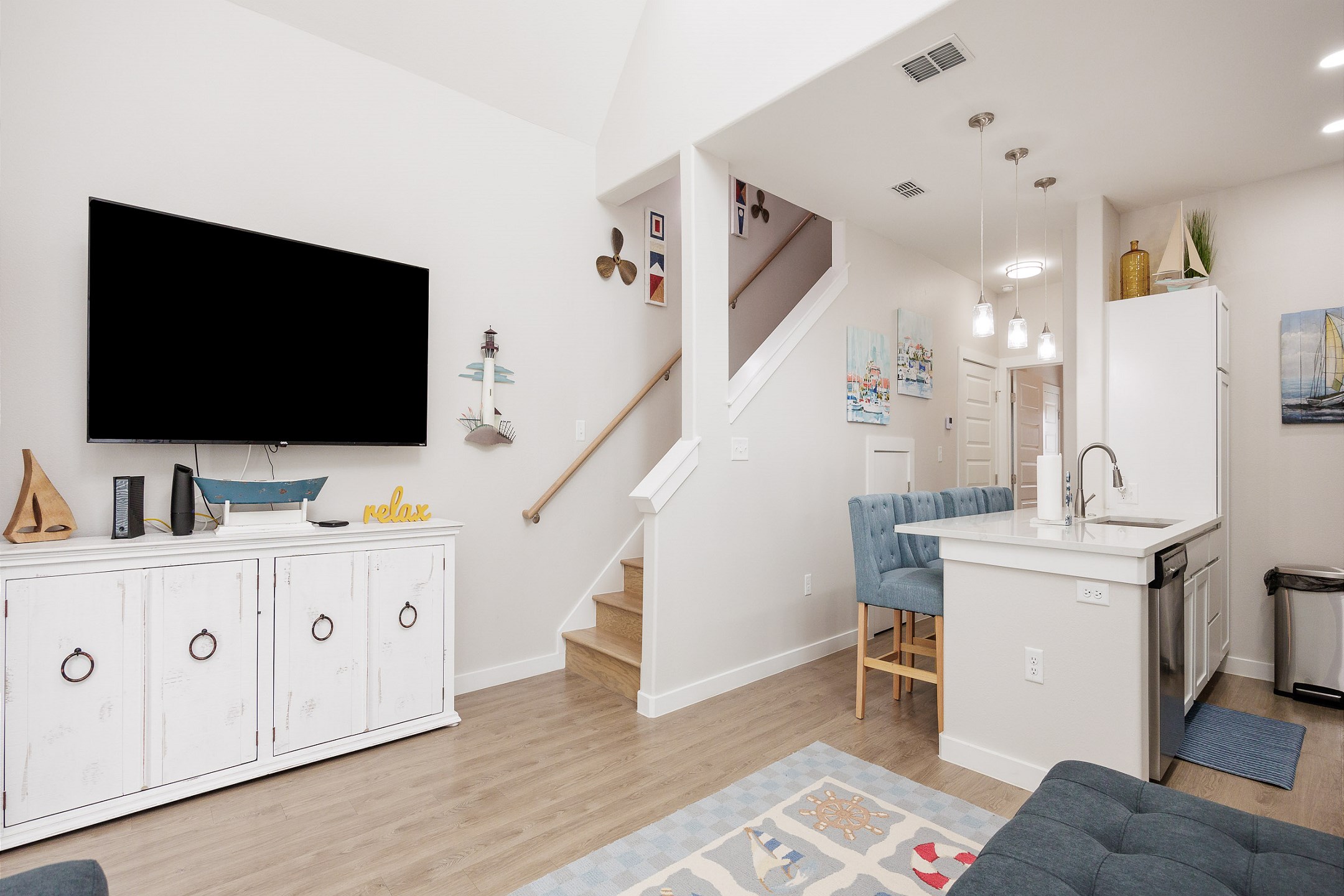 Modern entertainment haven boasting a state-of-the-art flat-screen TV, streaming services, and comfortable lounging options for movie nights